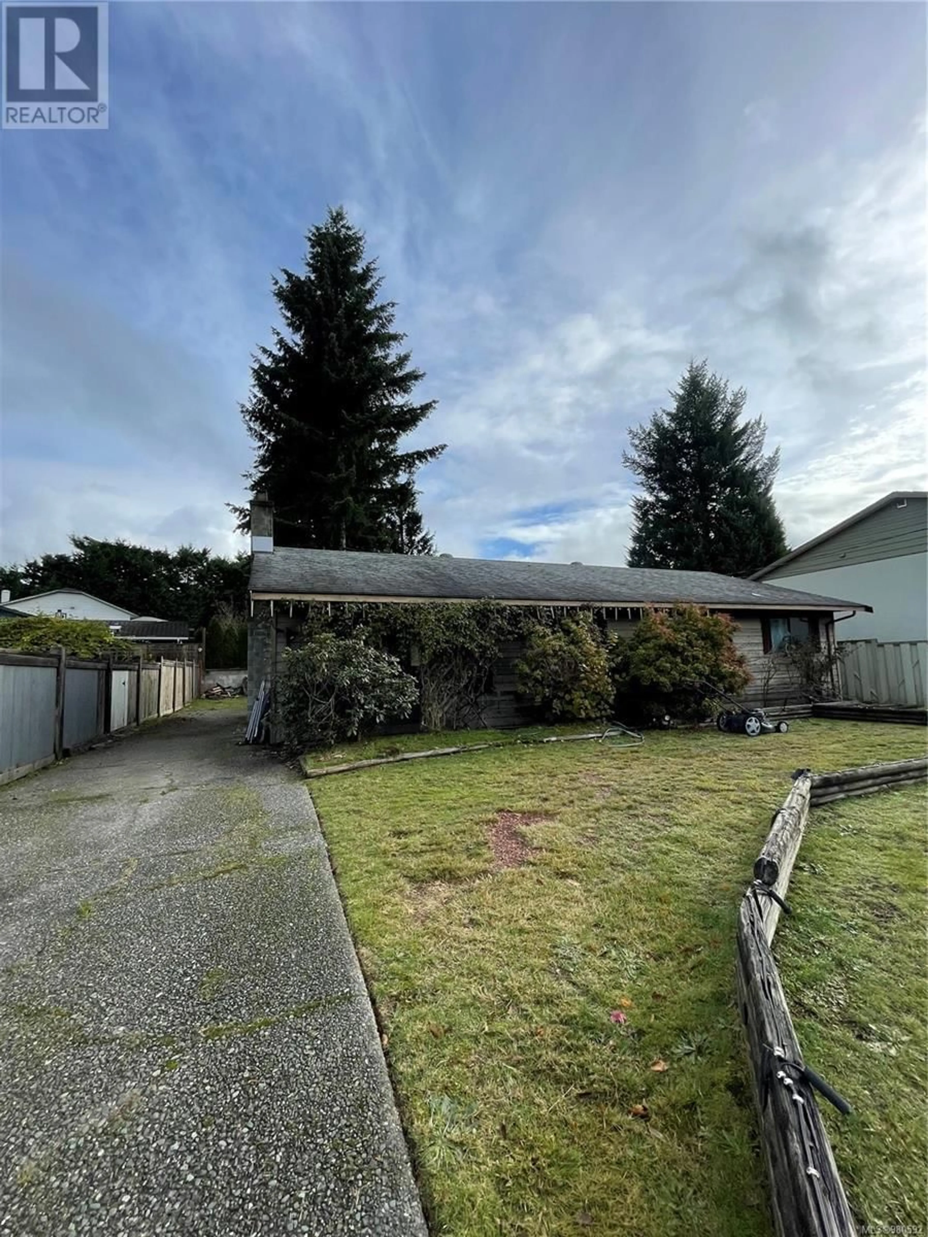 Frontside or backside of a home, the fenced backyard for 451 McPhedran St, Campbell River British Columbia V9W6S5