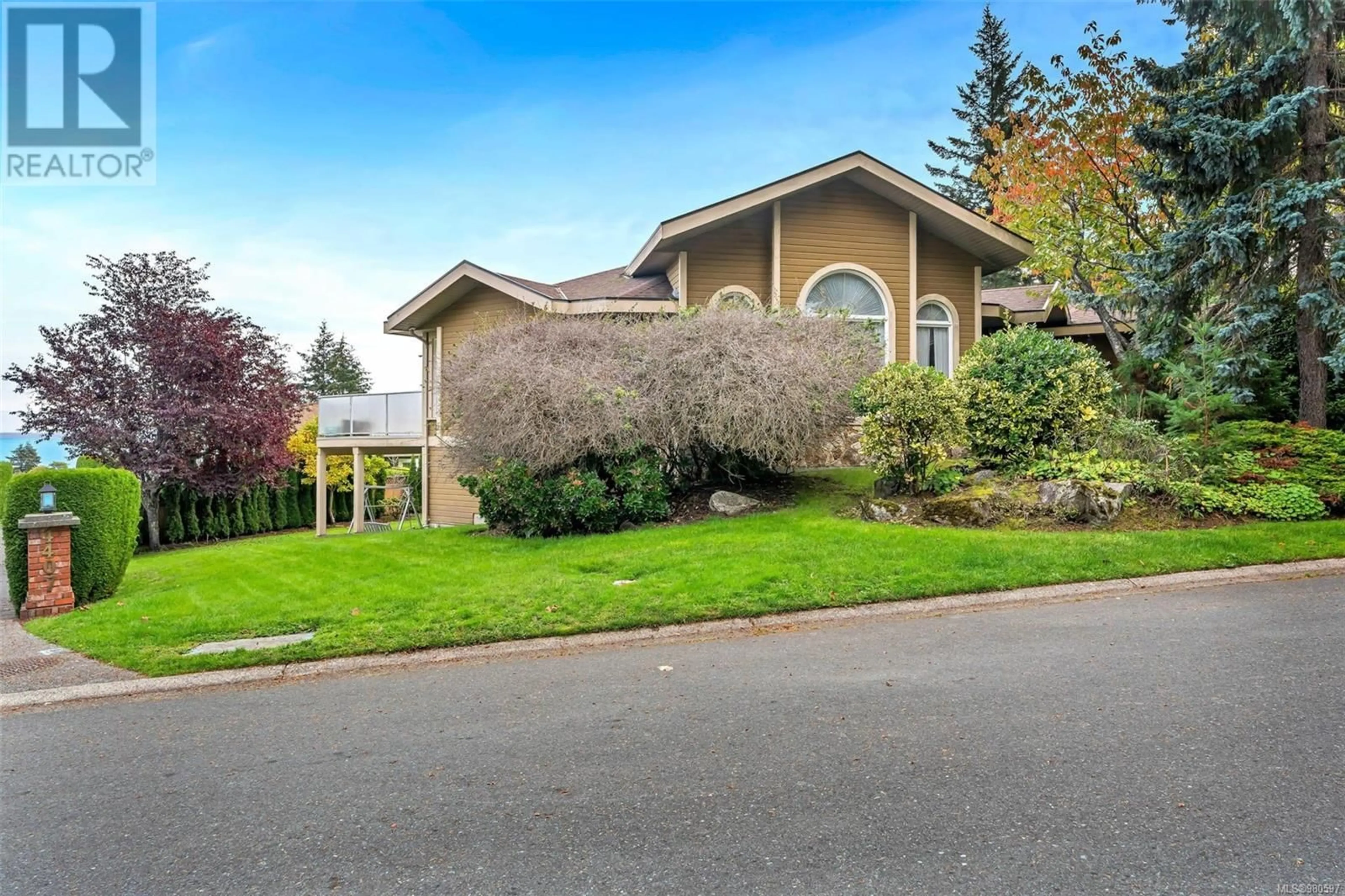 Frontside or backside of a home, the street view for 4405 Moonlight Lane, Saanich British Columbia V8N6K7