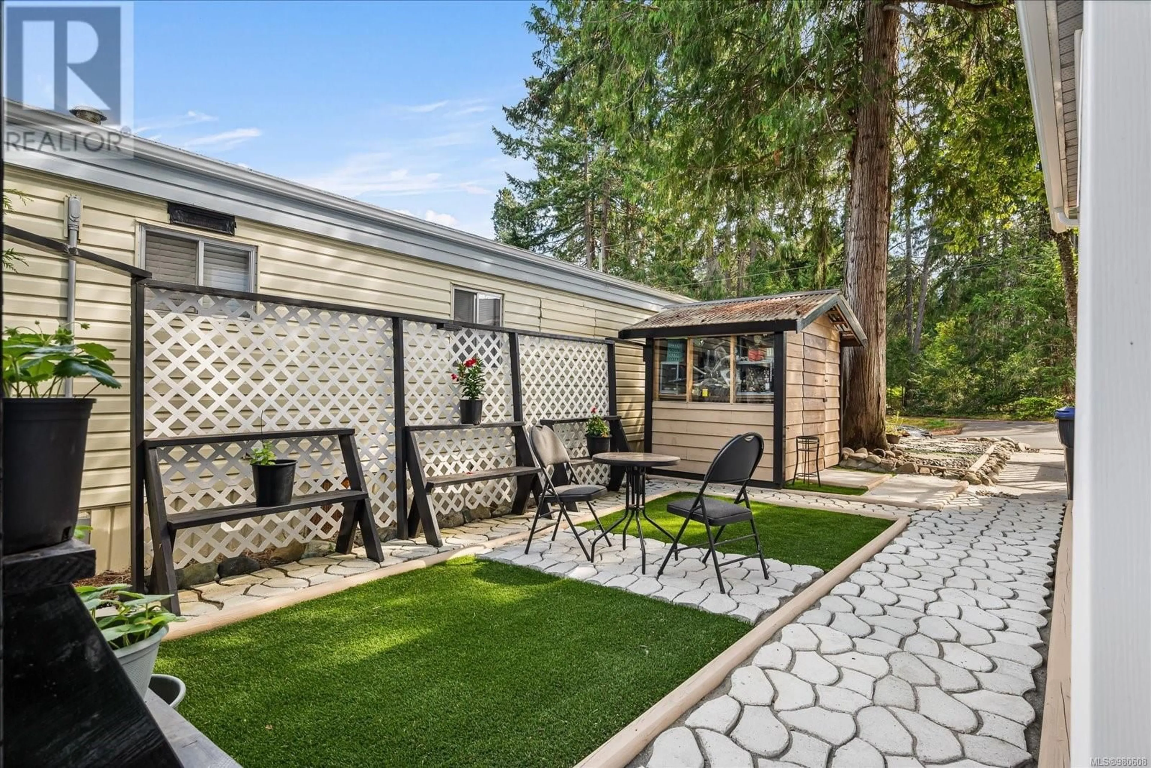 Patio, the fenced backyard for 7 1247 Arbutus Rd, Parksville British Columbia V9P1R4