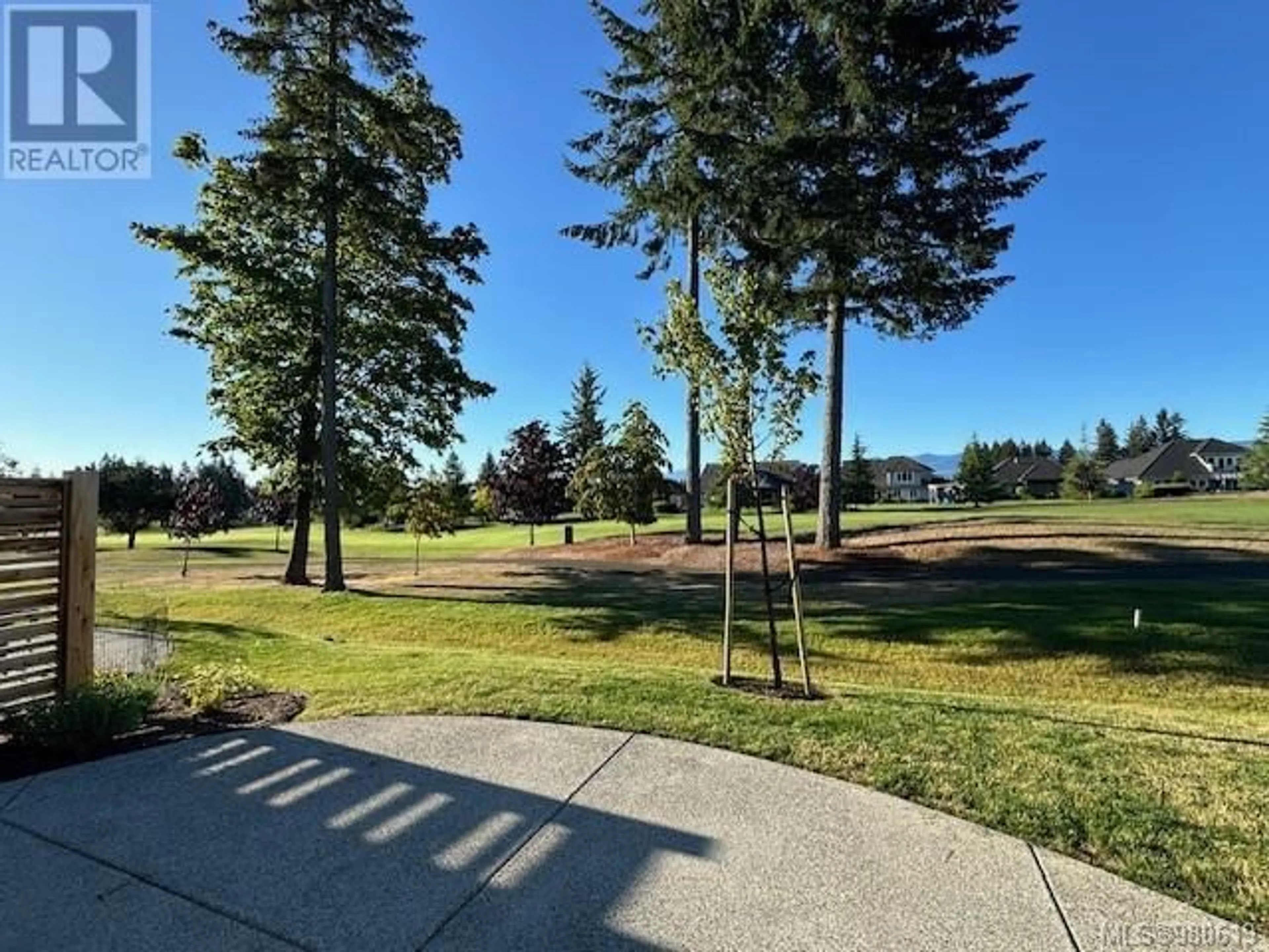 A pic from exterior of the house or condo, the fenced backyard for 141 1444 Crown Isle Dr, Courtenay British Columbia V9N0B8