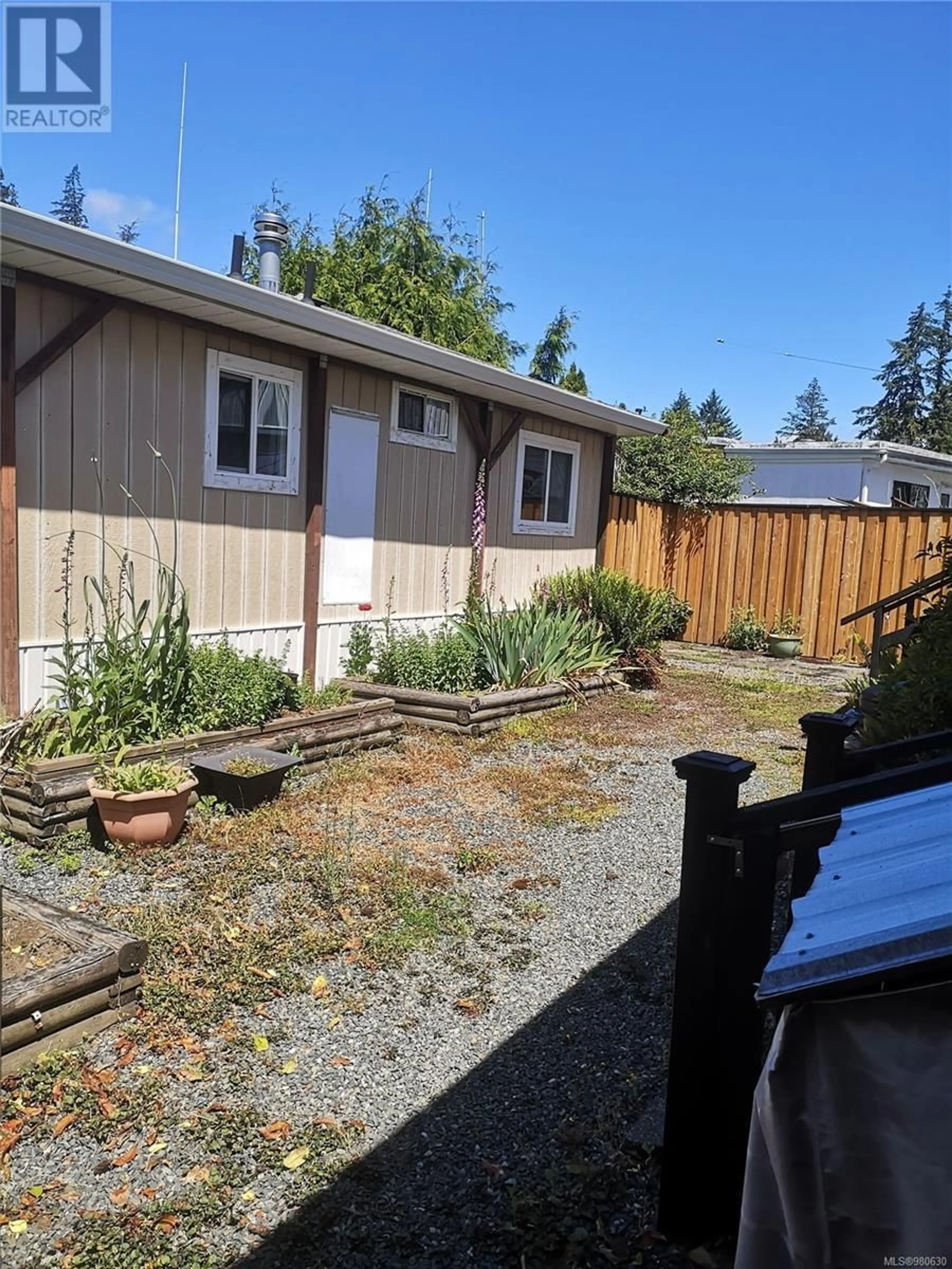 Frontside or backside of a home, the fenced backyard for 29 2911 Sooke Lake Rd, Langford British Columbia V9B4R5