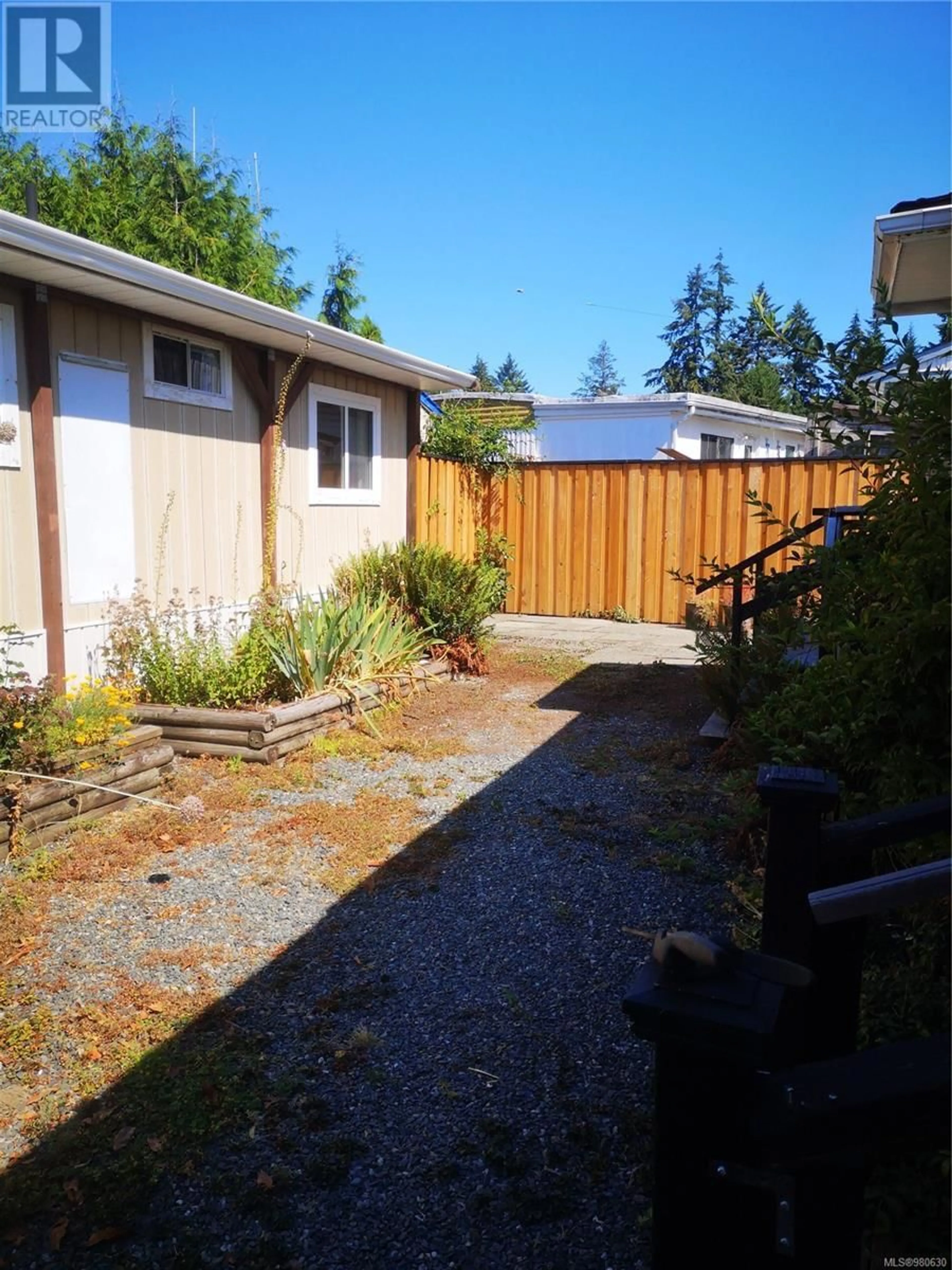 Frontside or backside of a home, the fenced backyard for 29 2911 Sooke Lake Rd, Langford British Columbia V9B4R5