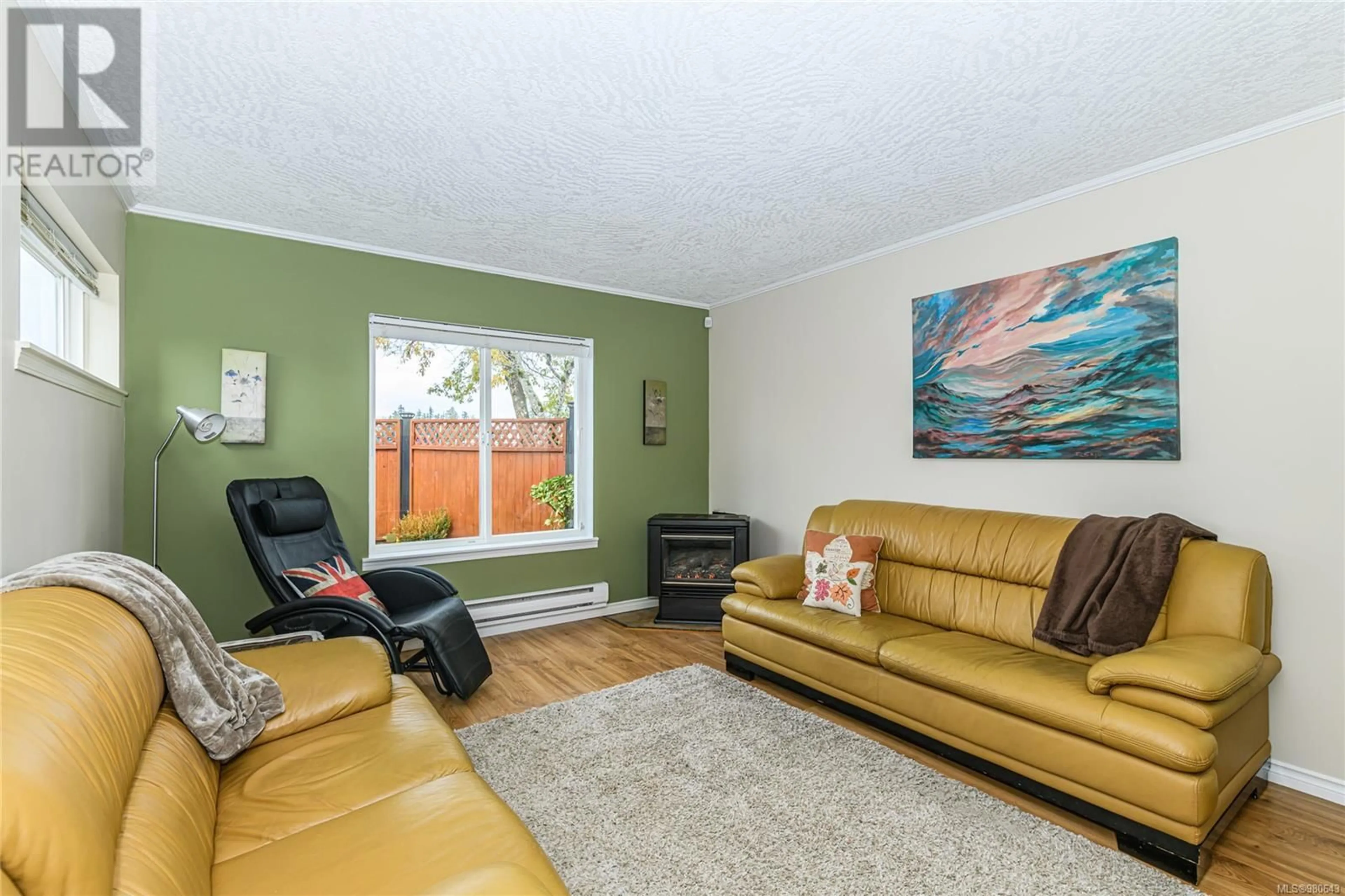 Living room, wood floors for 1 3266 Auchinachie Rd, Duncan British Columbia V9L4V2