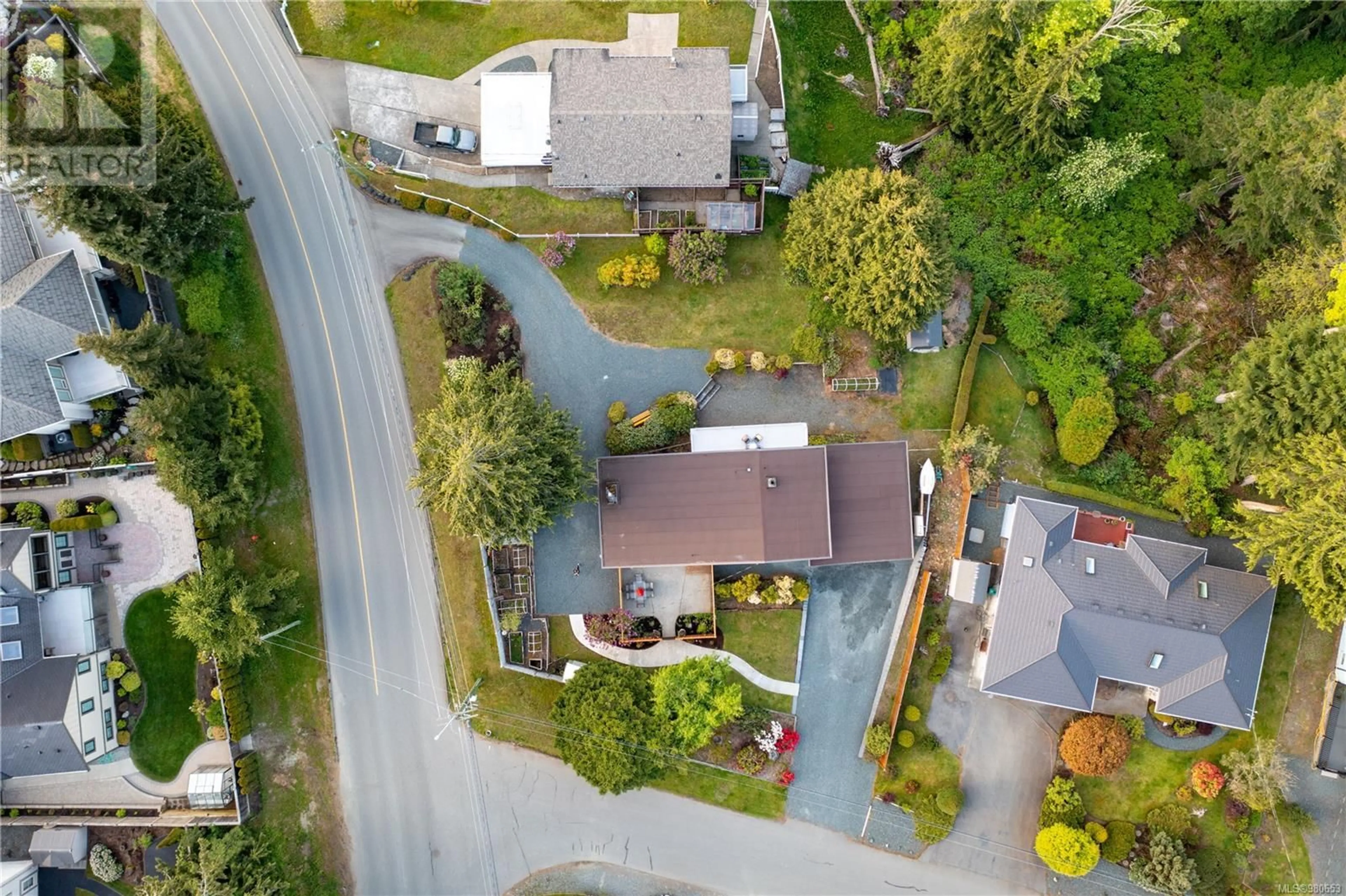 Frontside or backside of a home, the street view for 661 Belyea Rd, Qualicum Beach British Columbia V9K1H4