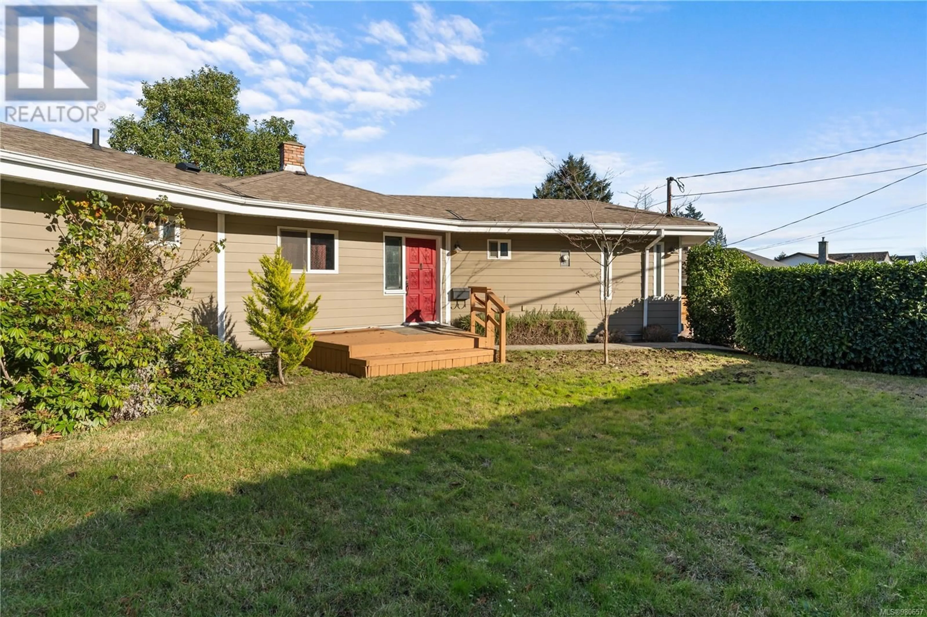 Frontside or backside of a home, the fenced backyard for 5590 Westdale Rd, Nanaimo British Columbia V9V1G4