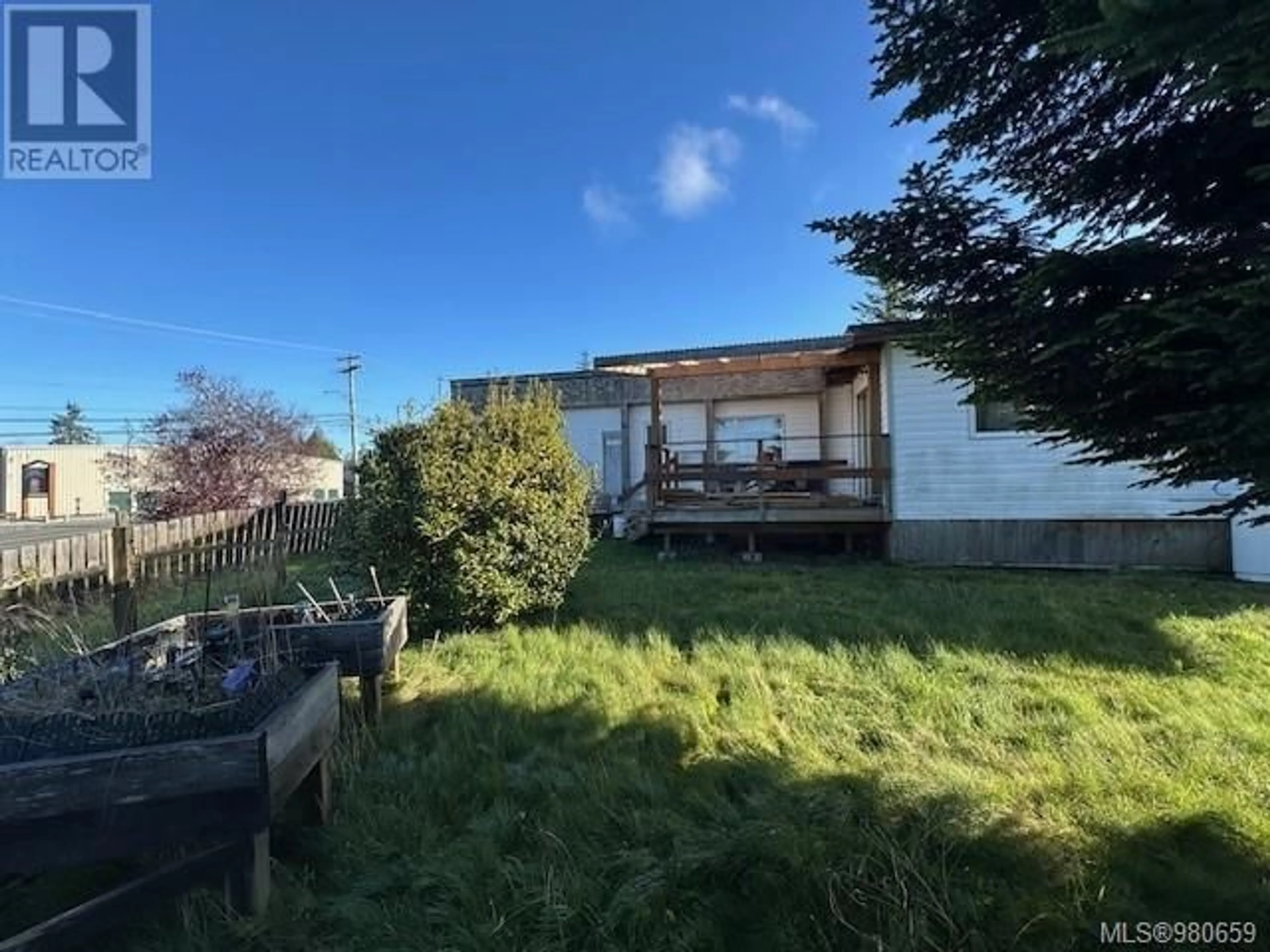 Frontside or backside of a home, the fenced backyard for 2248 Camosun Cres, Port McNeill British Columbia V0N2R0