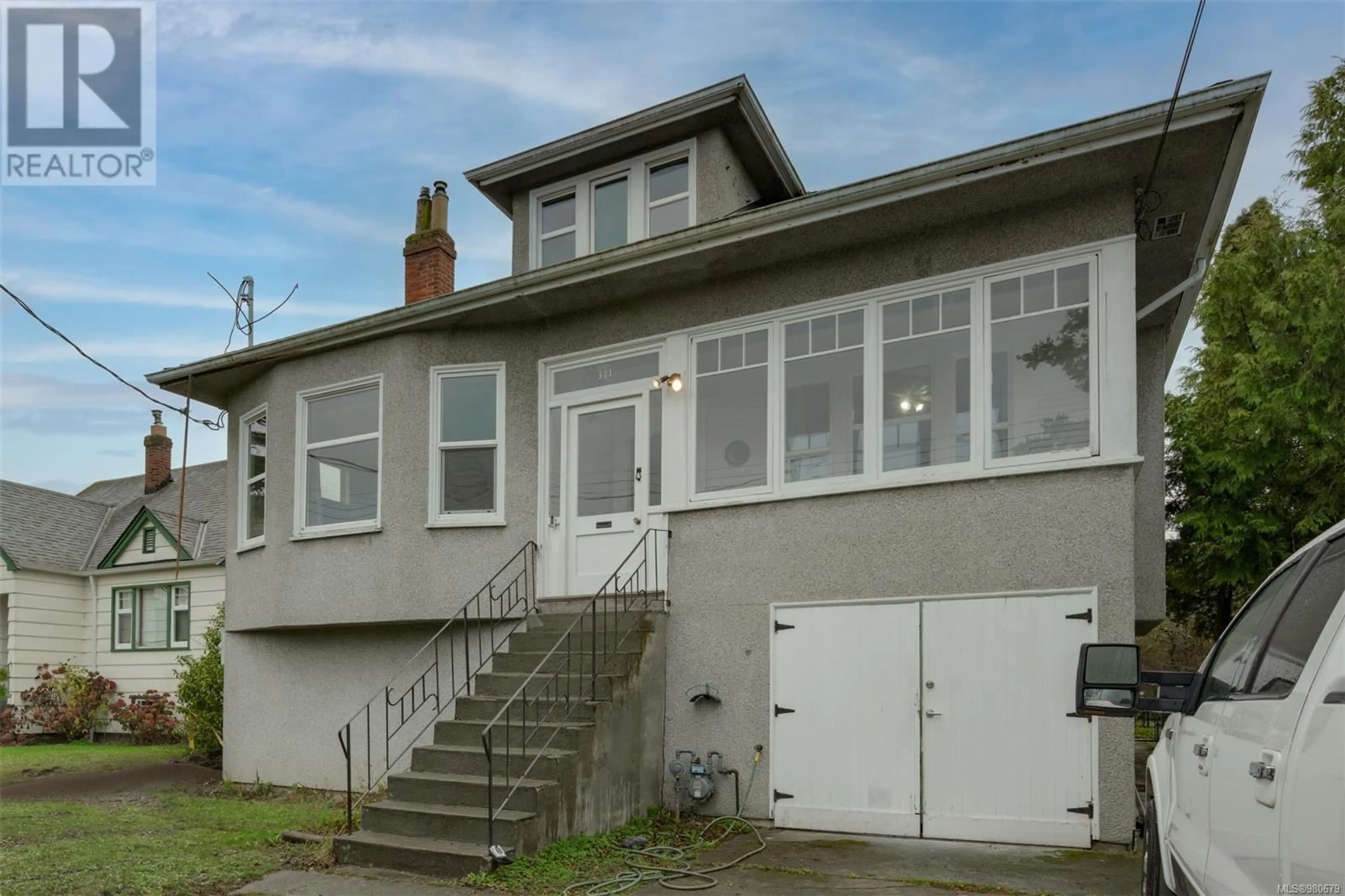 Frontside or backside of a home, the front or back of building for 381 Obed Ave, Saanich British Columbia V9A1K3