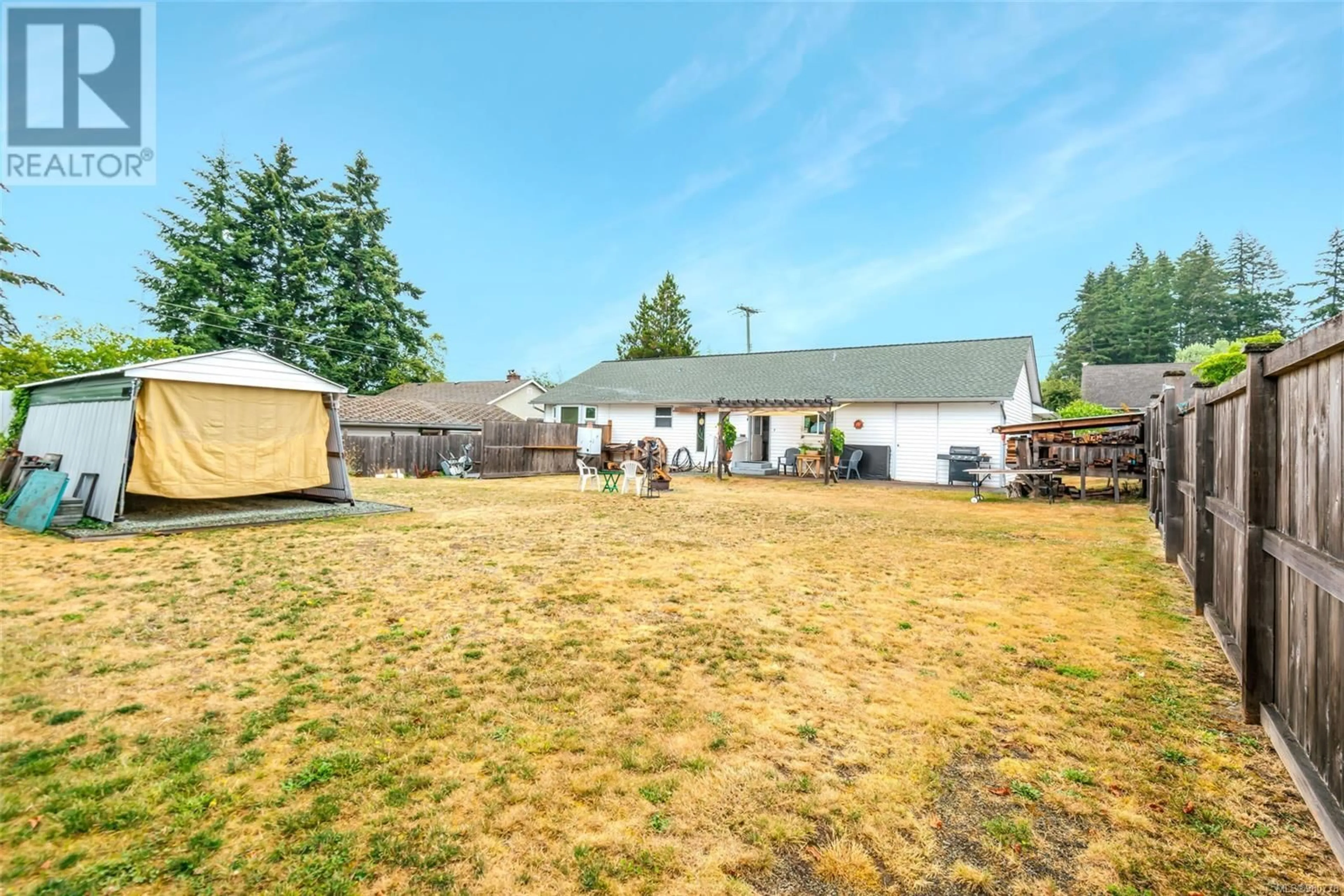 Frontside or backside of a home, the fenced backyard for 4218 Hollywood St, Port Alberni British Columbia V9Y4B2