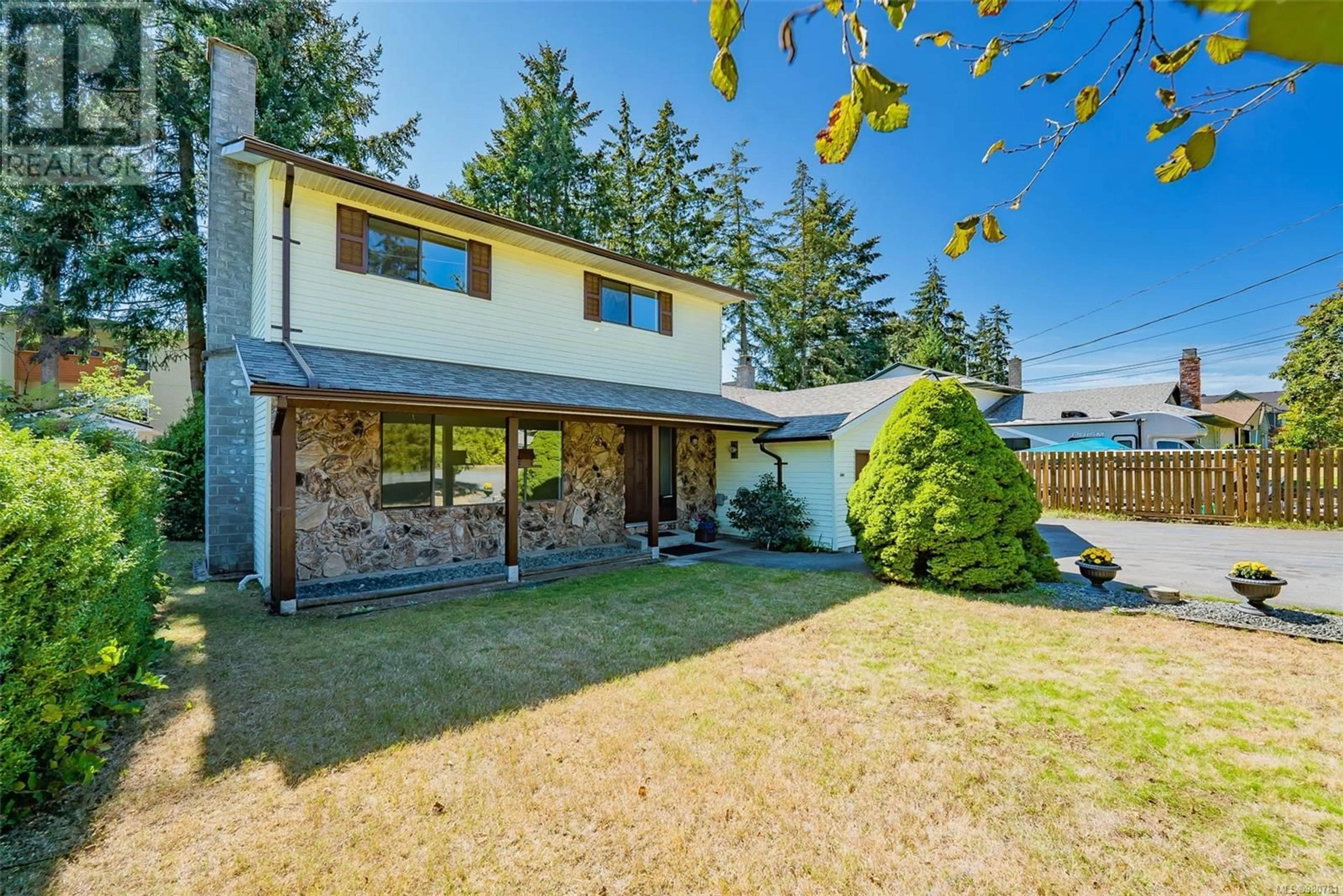 Frontside or backside of a home, the fenced backyard for 2465 Divot Dr, Nanaimo British Columbia V9T4B1