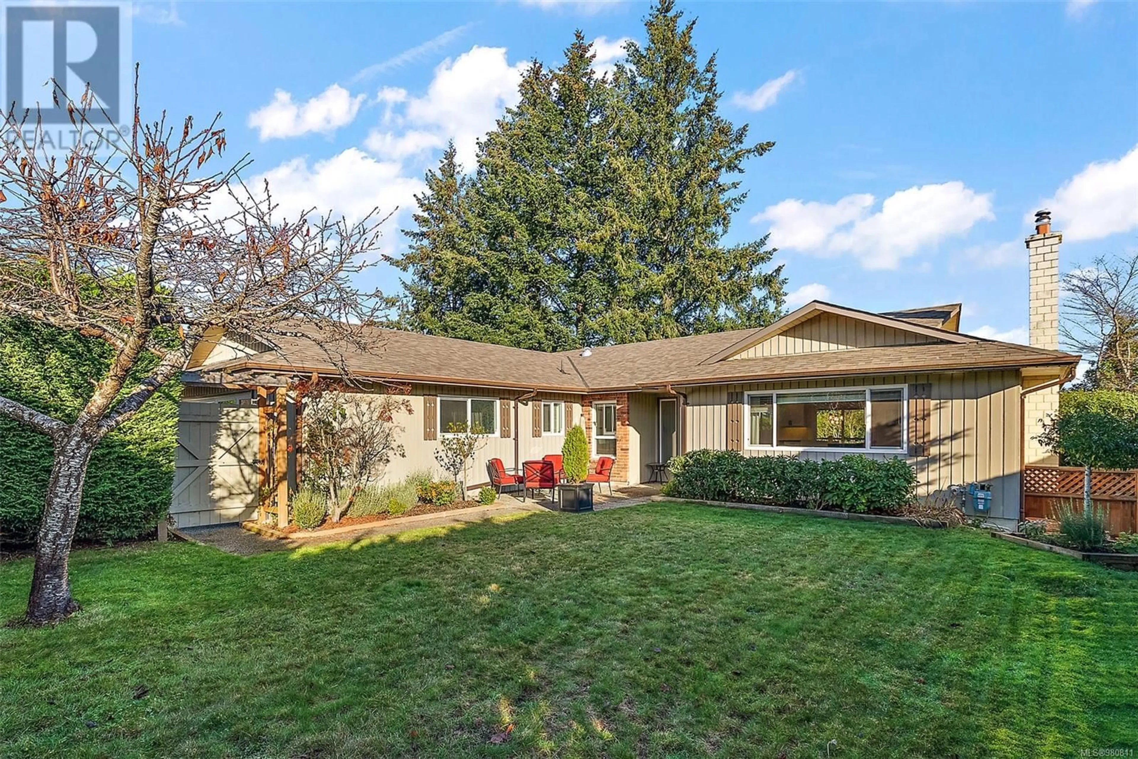 Frontside or backside of a home, the fenced backyard for 7205 Skyline Cres, Central Saanich British Columbia V8M1M4