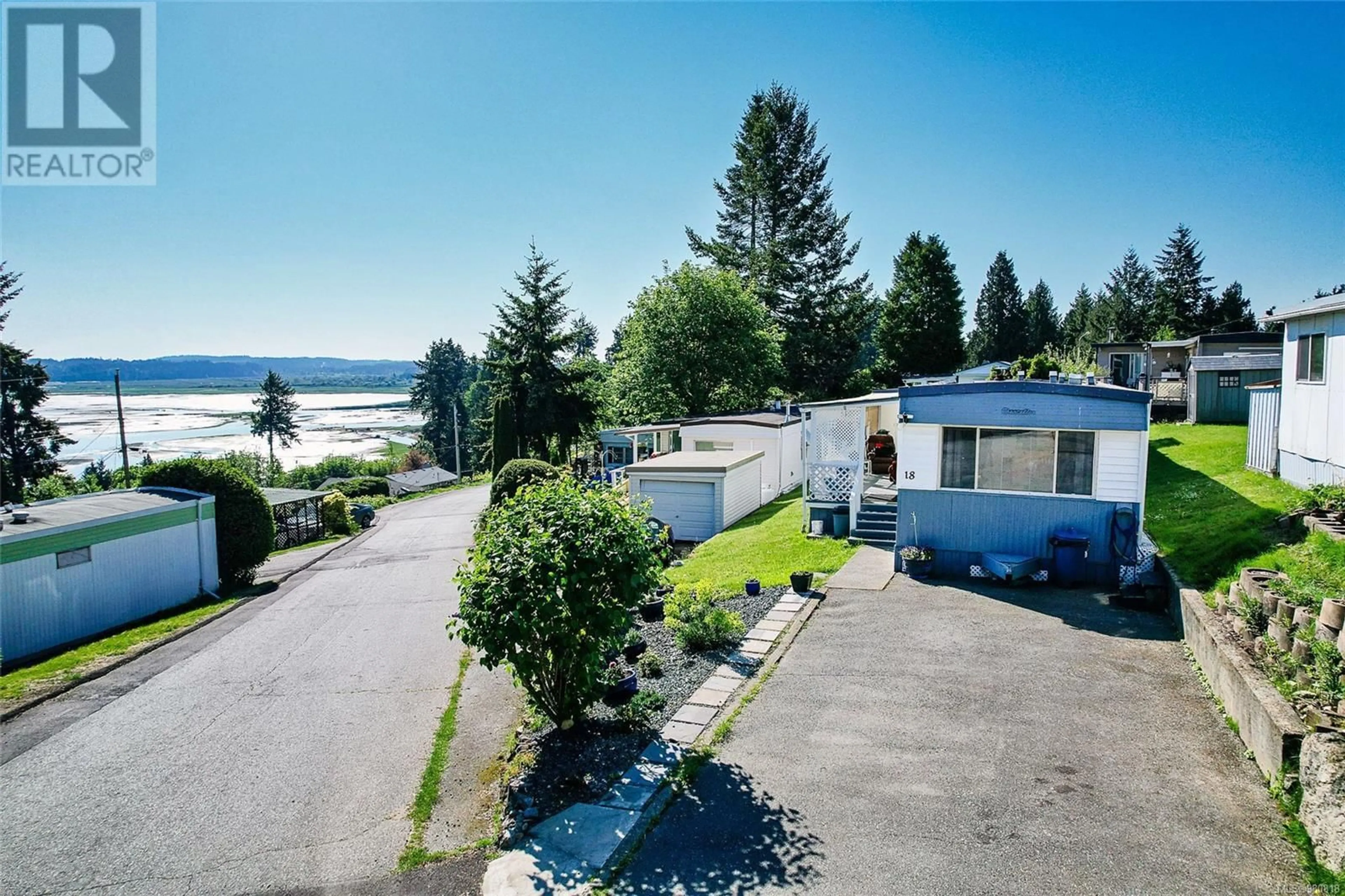 A pic from exterior of the house or condo, lake for 18 1000 Chase River Rd, Nanaimo British Columbia V9R6W7