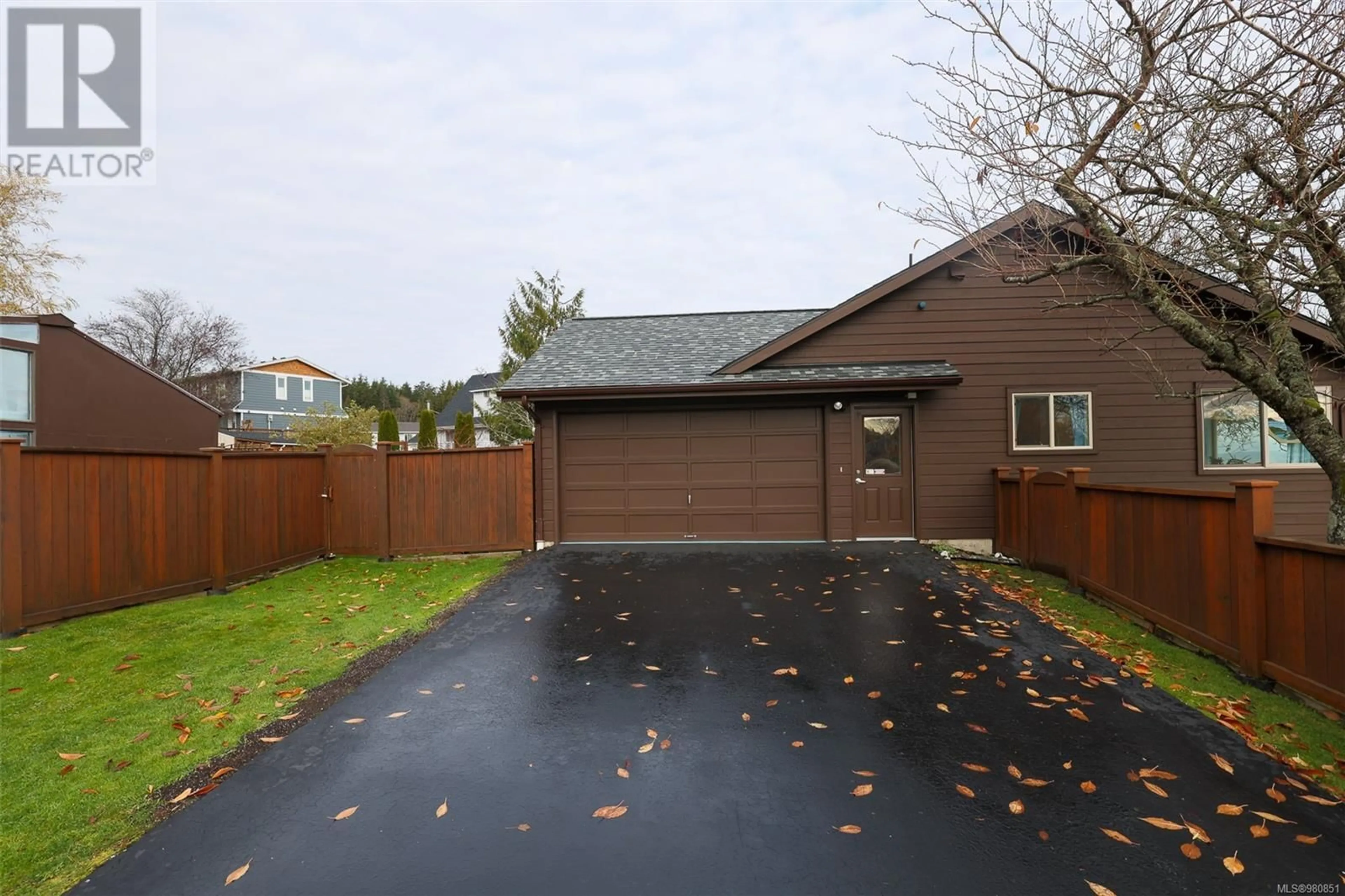 Frontside or backside of a home, the fenced backyard for 7445 Market St, Port Hardy British Columbia V0N2P0