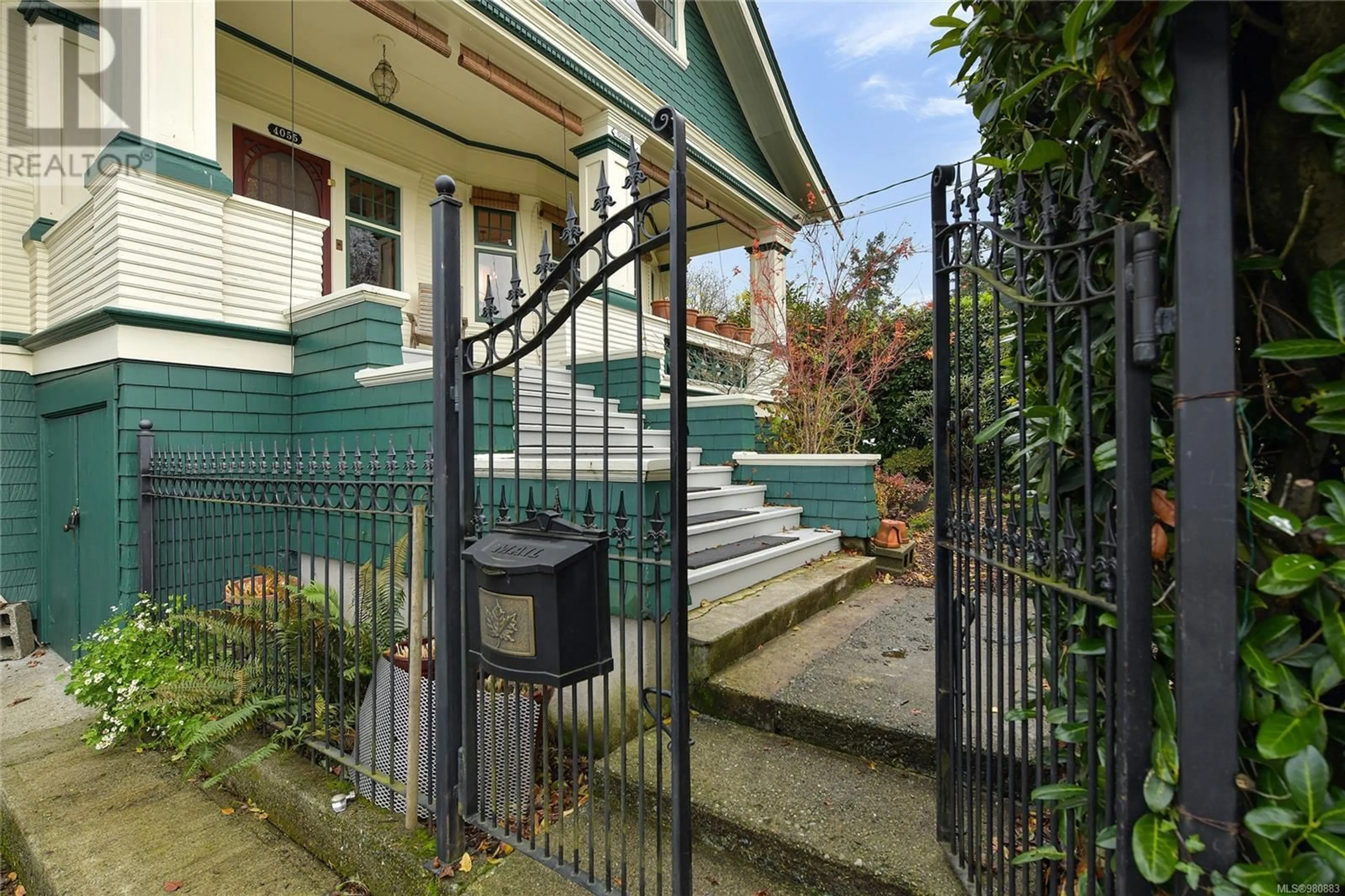 Frontside or backside of a home, the fenced backyard for 4055 Zinnia Rd, Saanich British Columbia V8Z4W2