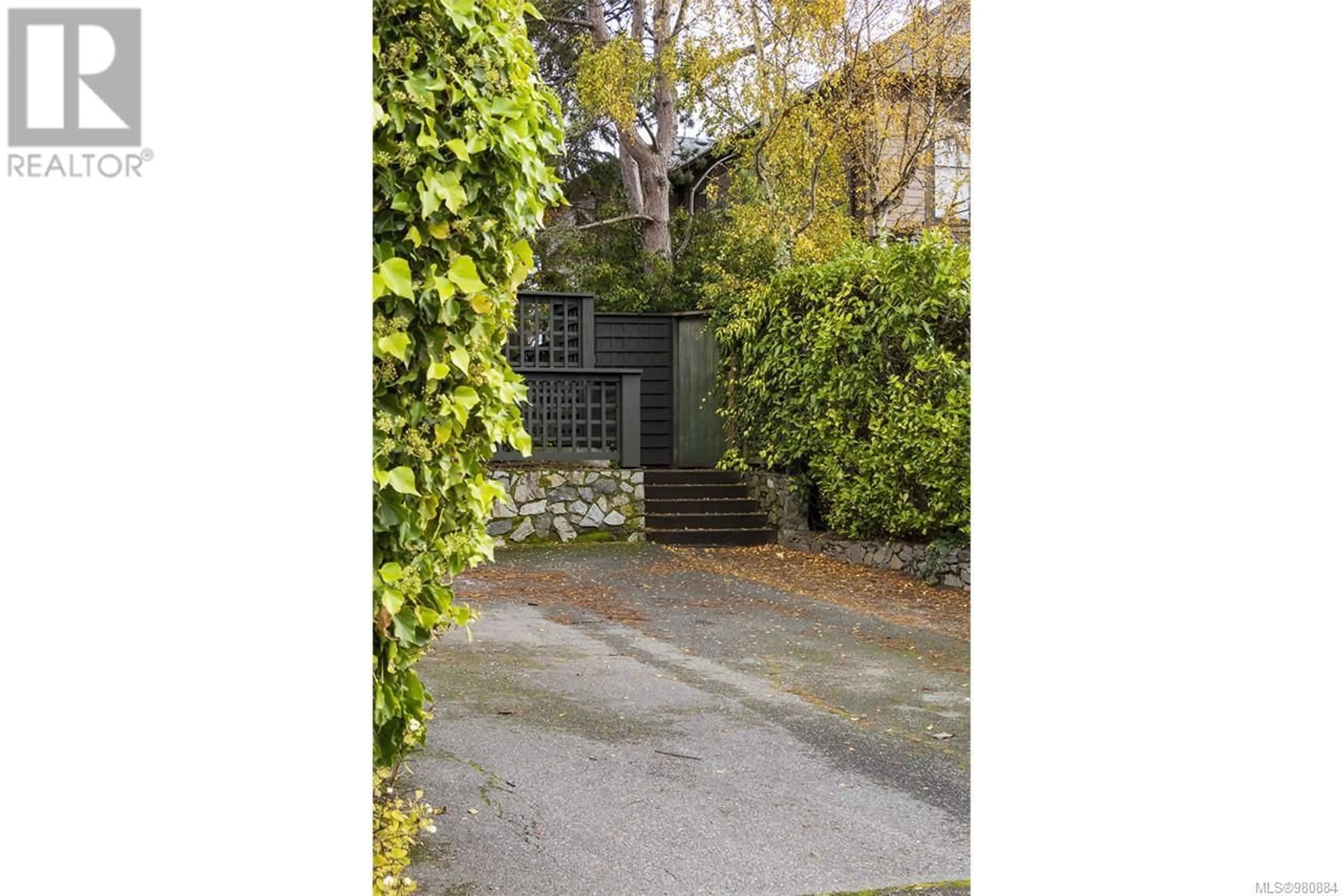 A pic from exterior of the house or condo, the fenced backyard for 213 Mary St, Victoria British Columbia V9A3V8