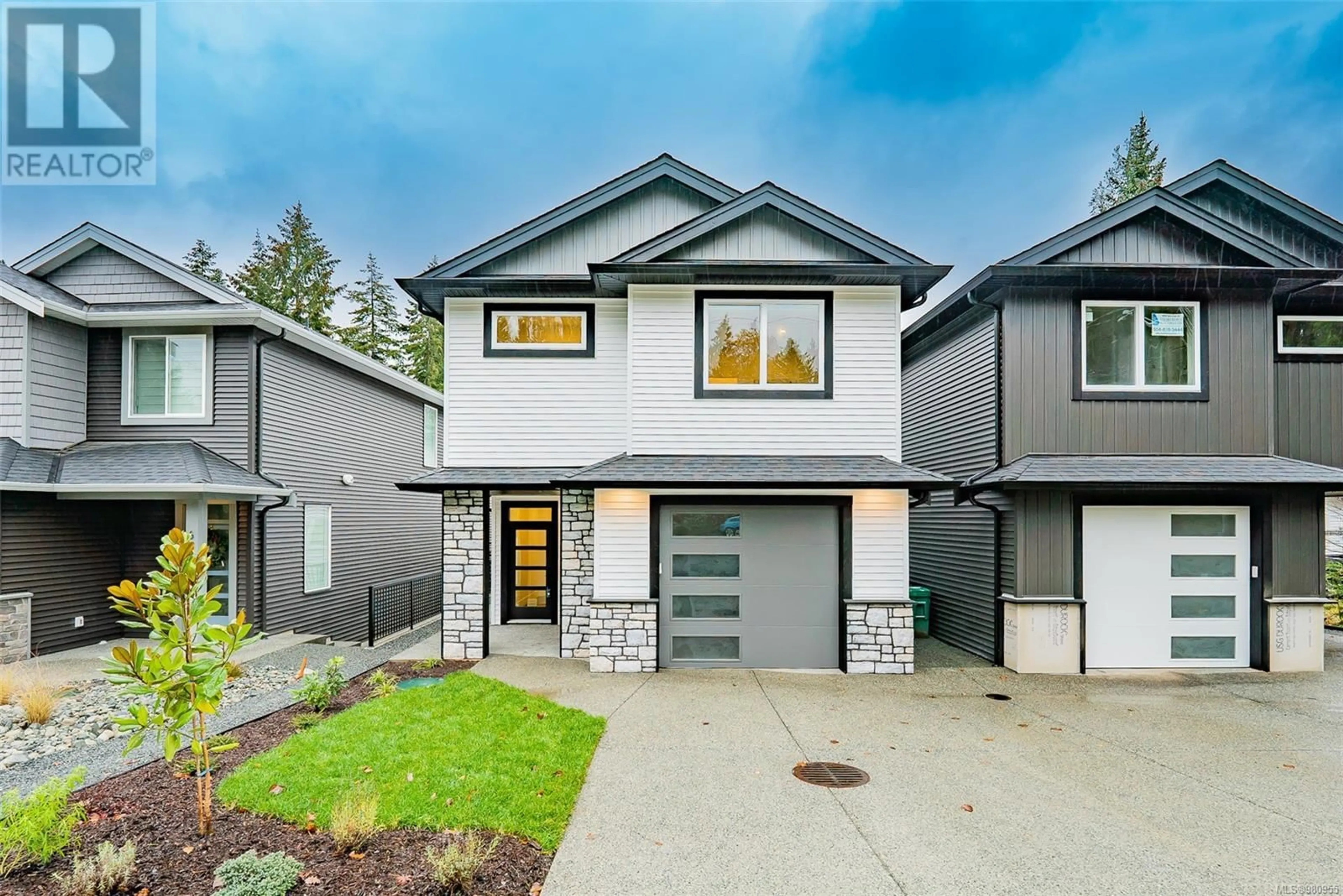 Frontside or backside of a home, the fenced backyard for A 6645 Aulds Rd, Lantzville British Columbia V9T5R7