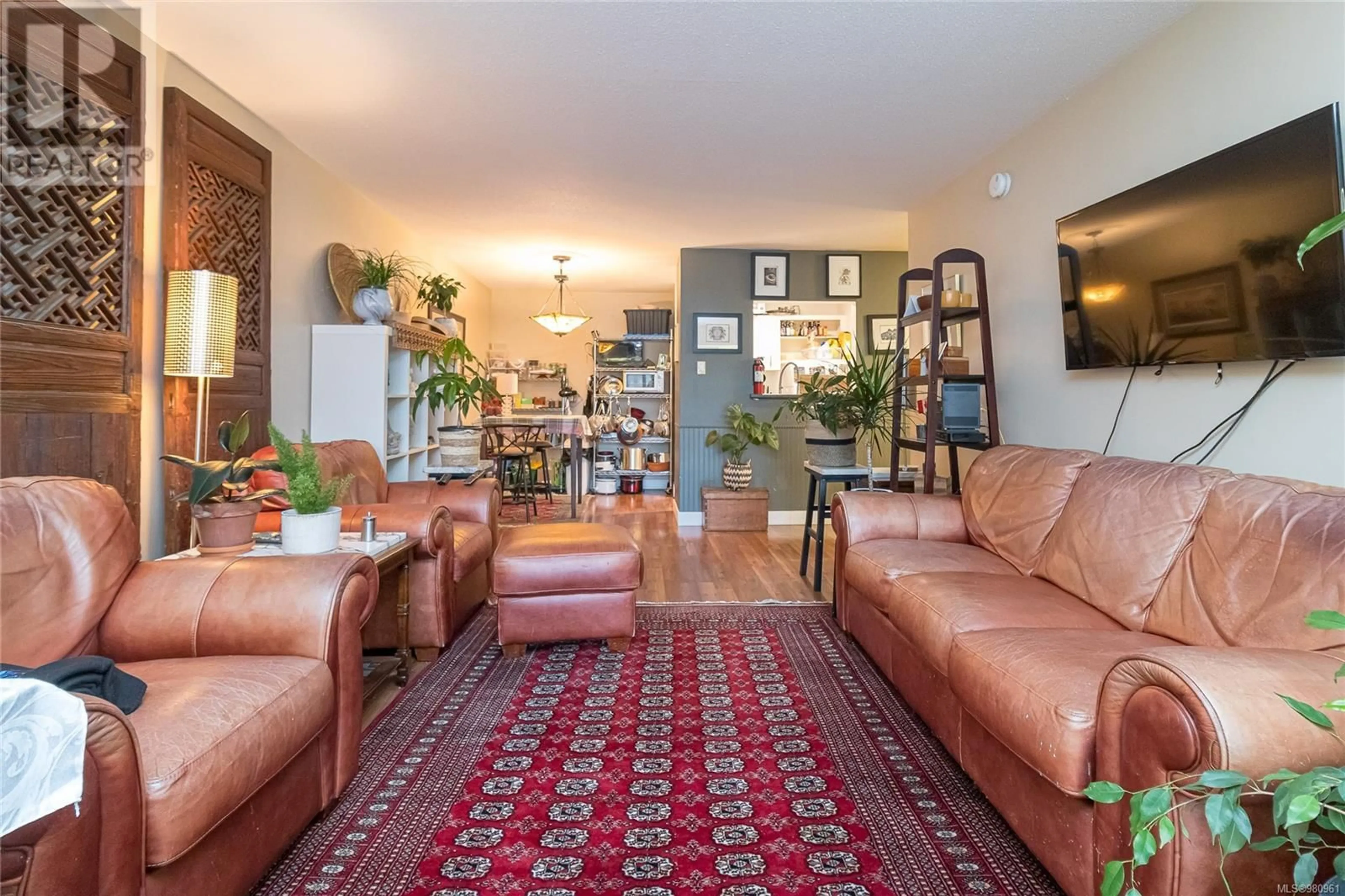 Living room, wood floors for 208 2050 White Birch Rd, Sidney British Columbia V8L2R2