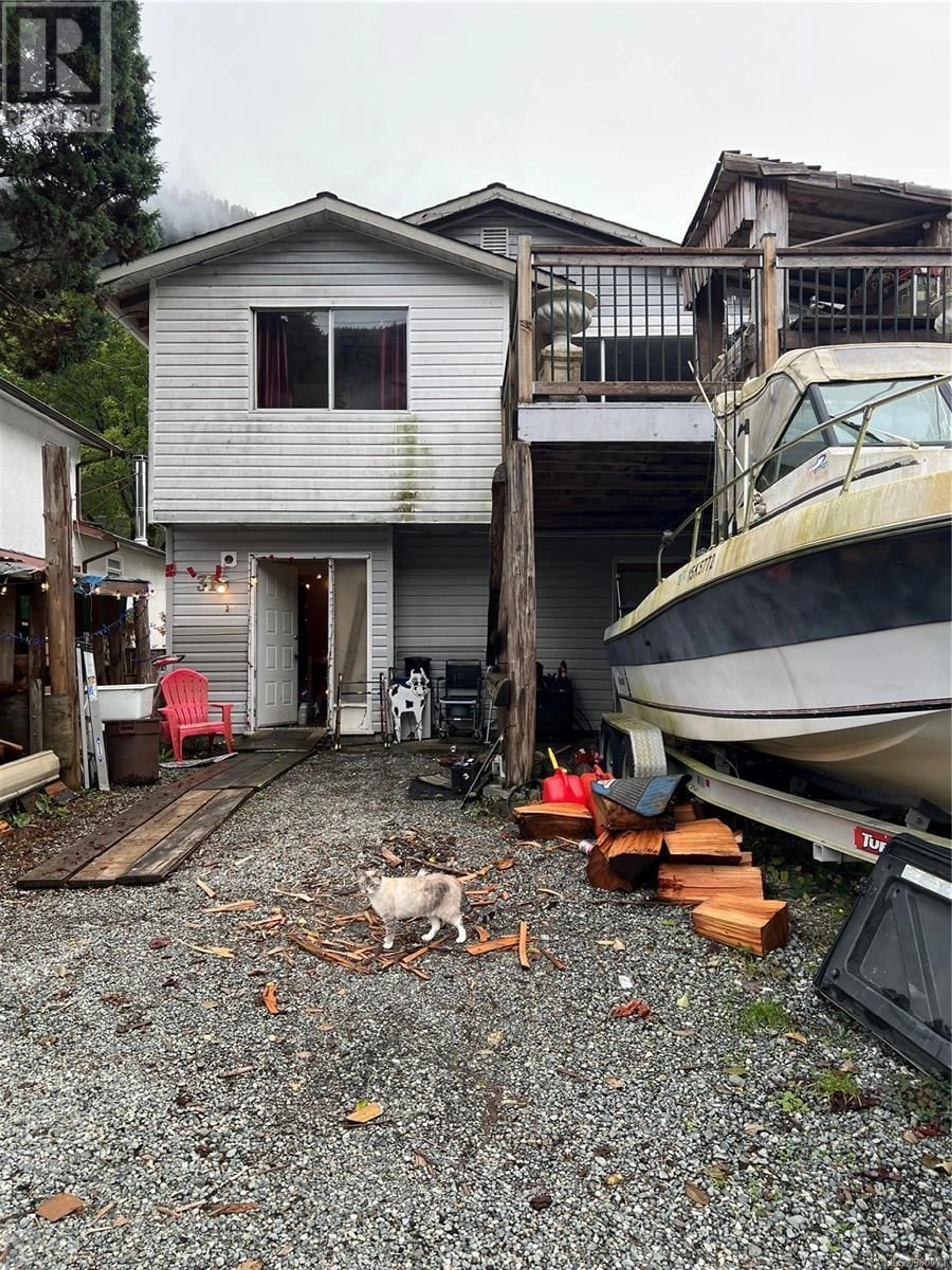 Frontside or backside of a home, the fenced backyard for 315 Maquinna Dr N, Tahsis British Columbia V0P1R0