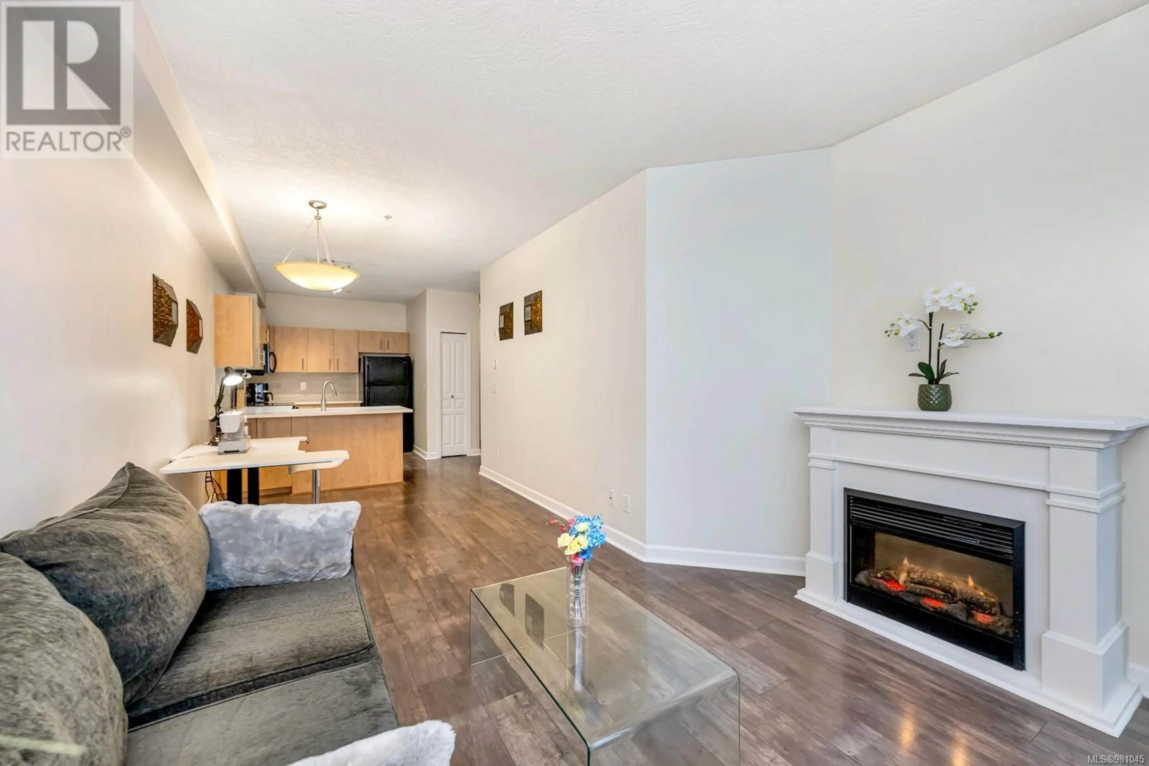 Living room, wood floors for 110 825 Goldstream Ave, Langford British Columbia V9B2X8