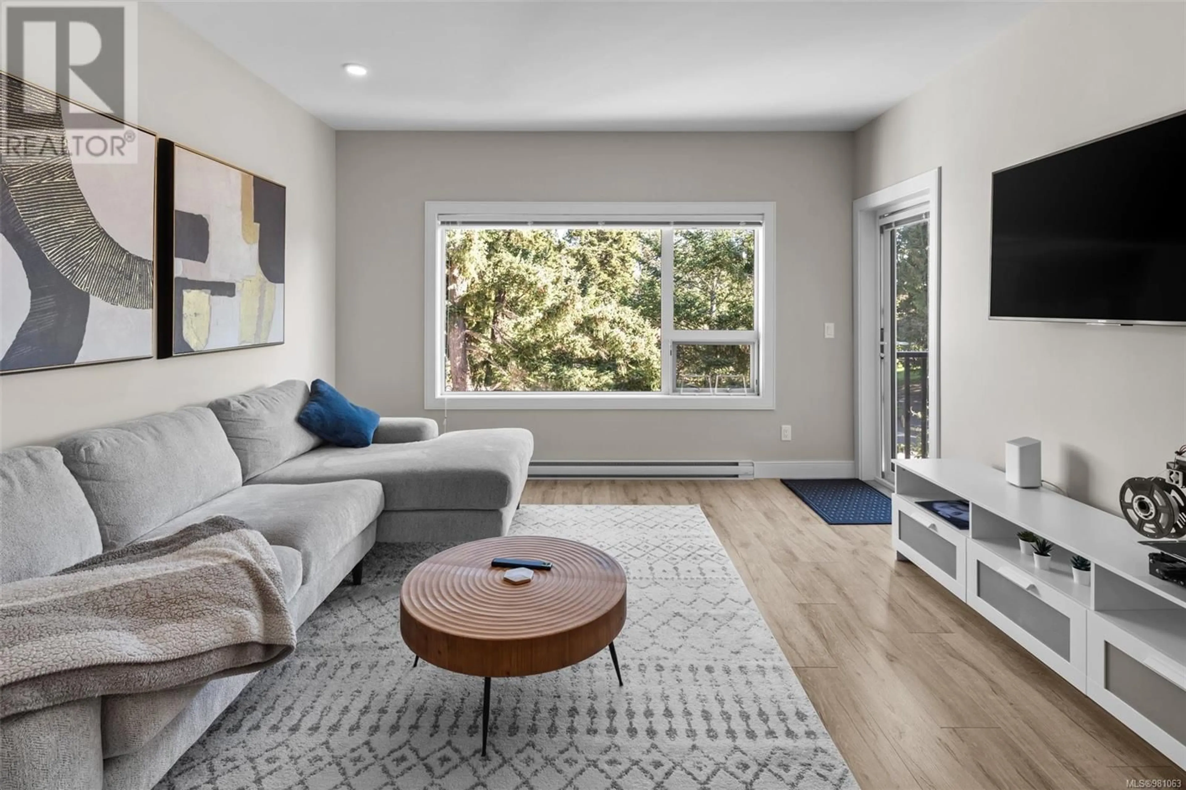 Living room, wood floors for 408 280 Island Hwy, View Royal British Columbia V9B1G5