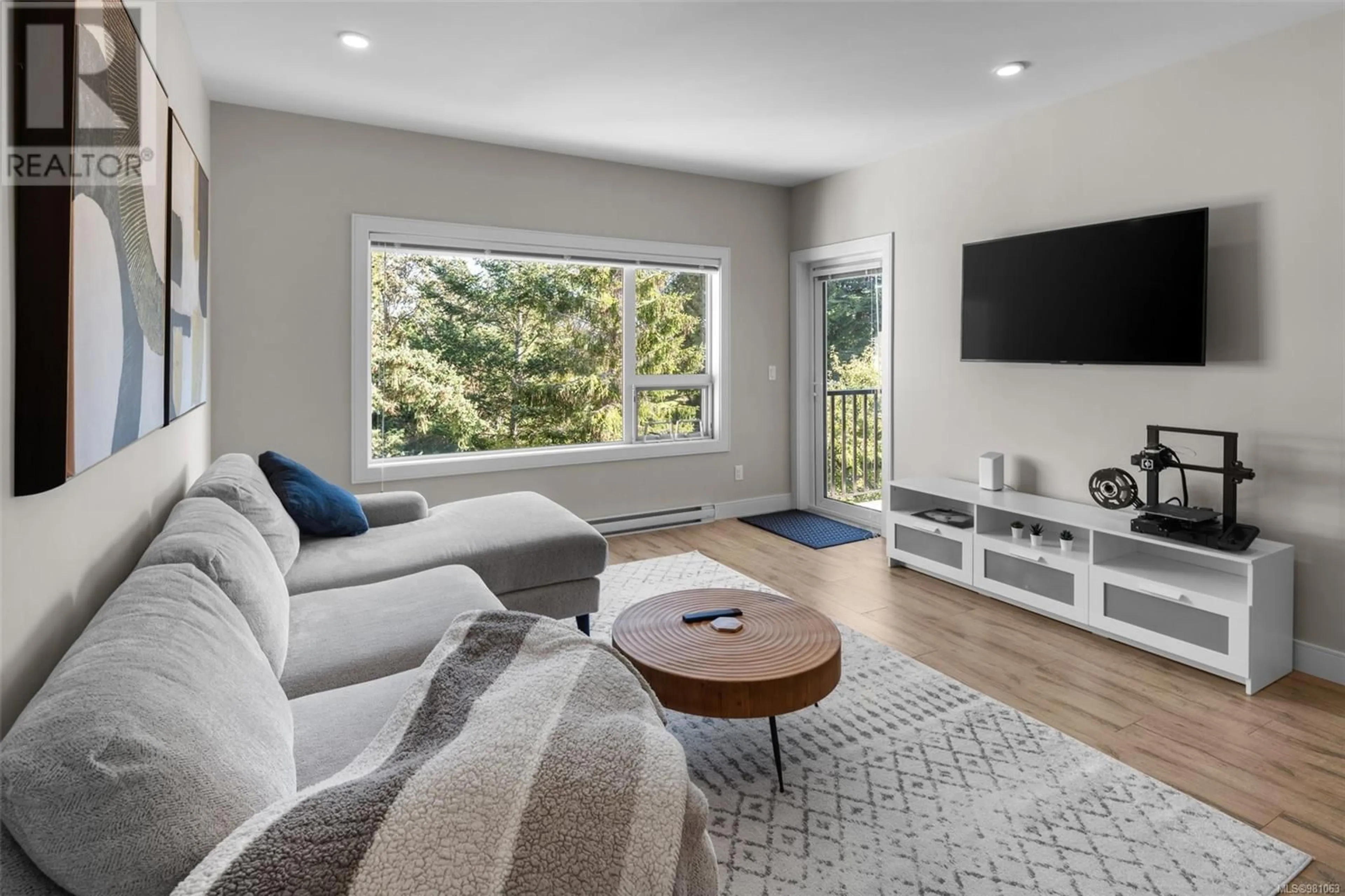 Living room, wood floors for 408 280 Island Hwy, View Royal British Columbia V9B1G5