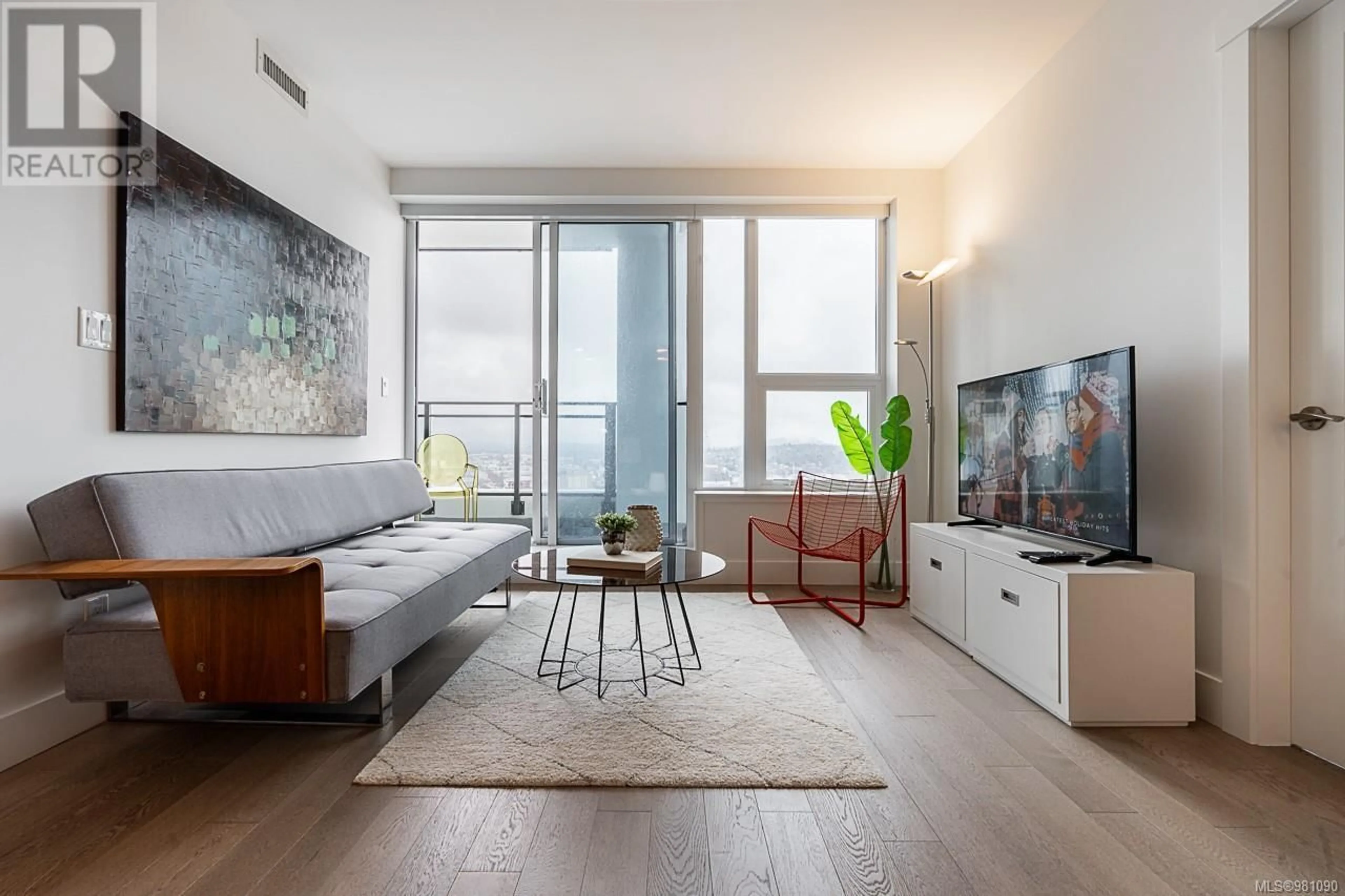Living room with furniture, wood/laminate floor for 2303 - 777 HERALD STREET, Victoria British Columbia V8T0C7
