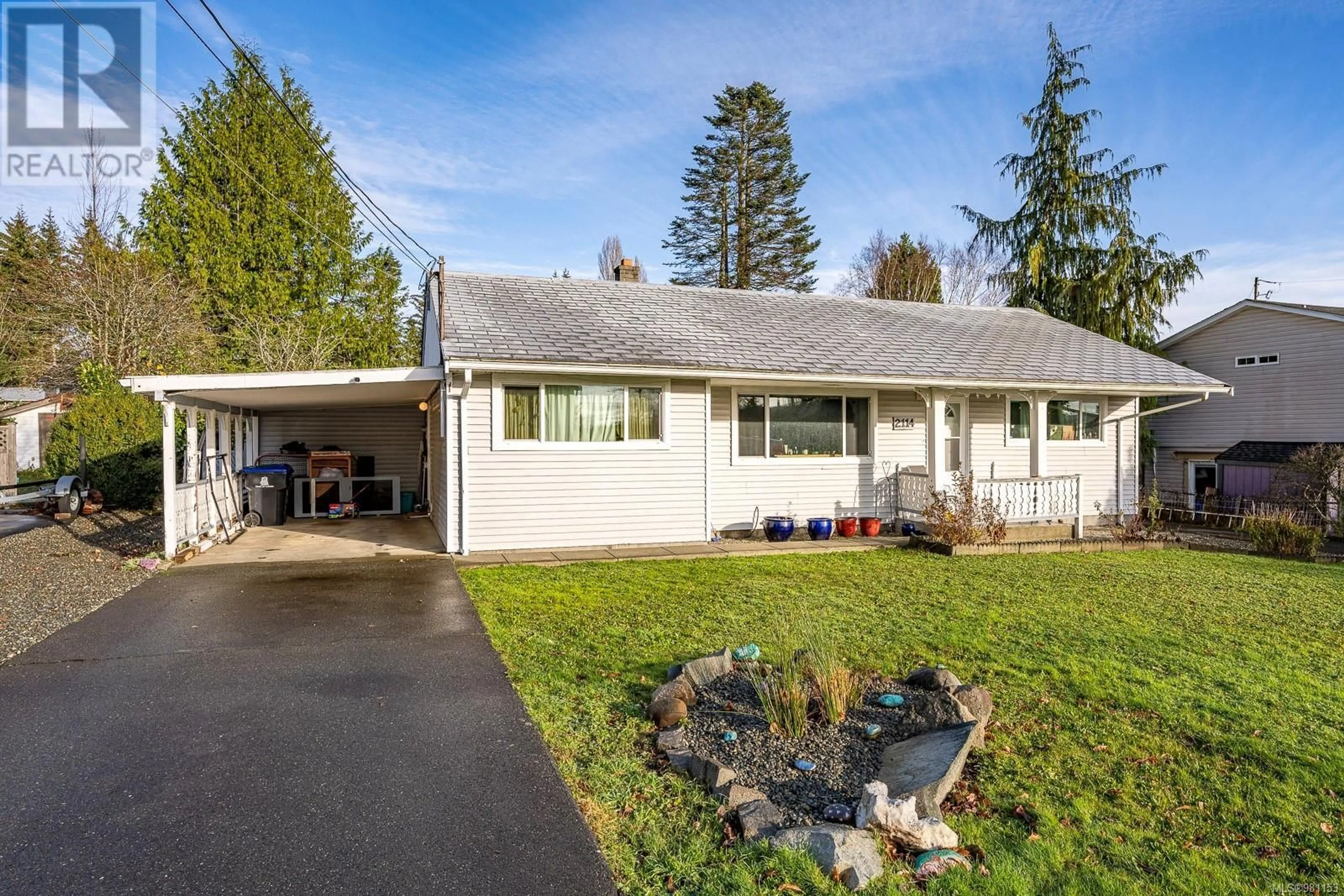 Frontside or backside of a home, the fenced backyard for 2114 McKenzie Ave, Comox British Columbia V9M1M7