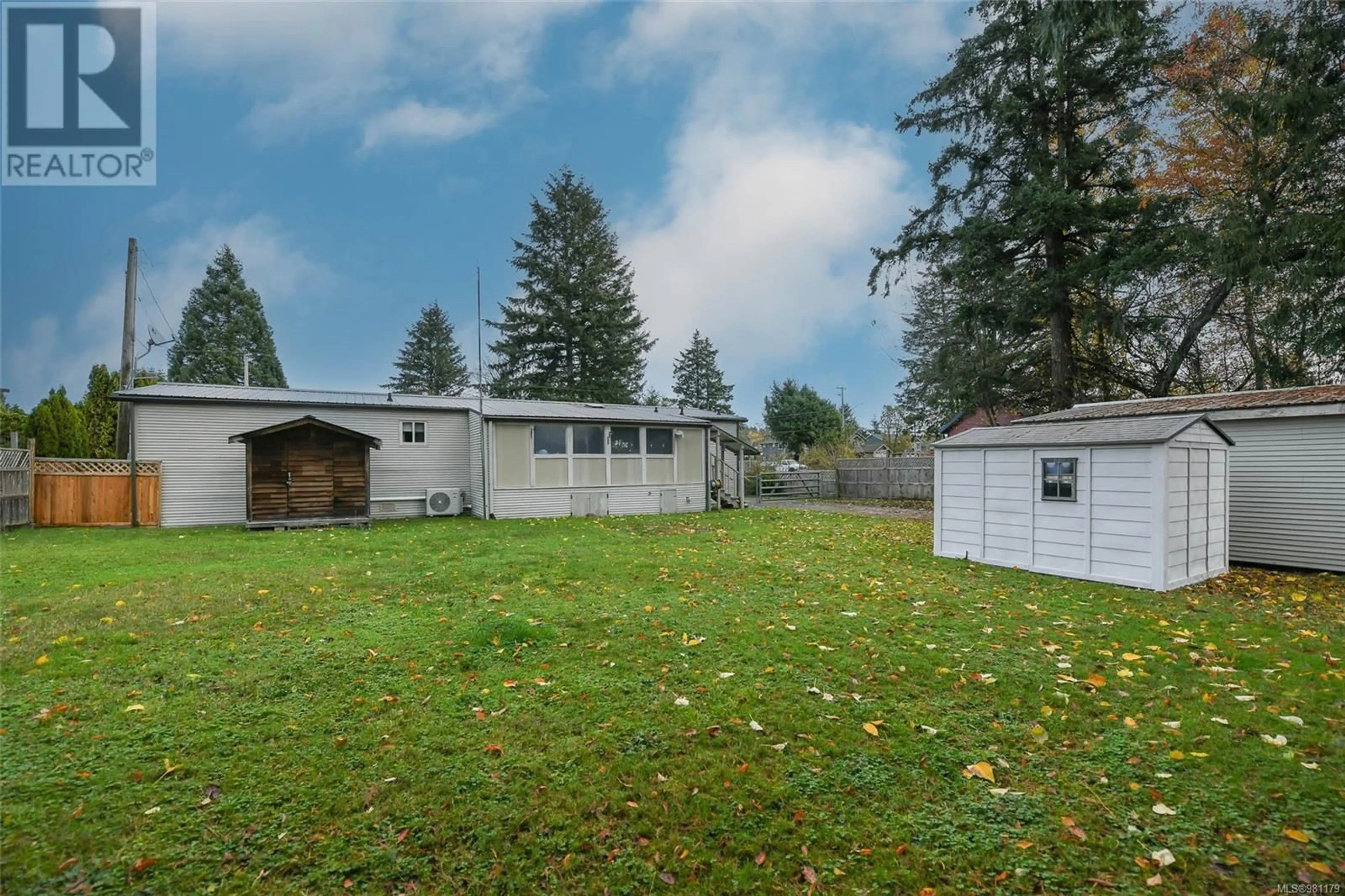 Frontside or backside of a home, the fenced backyard for 4719 Mapleridge Dr, Courtenay British Columbia V9N5Z3