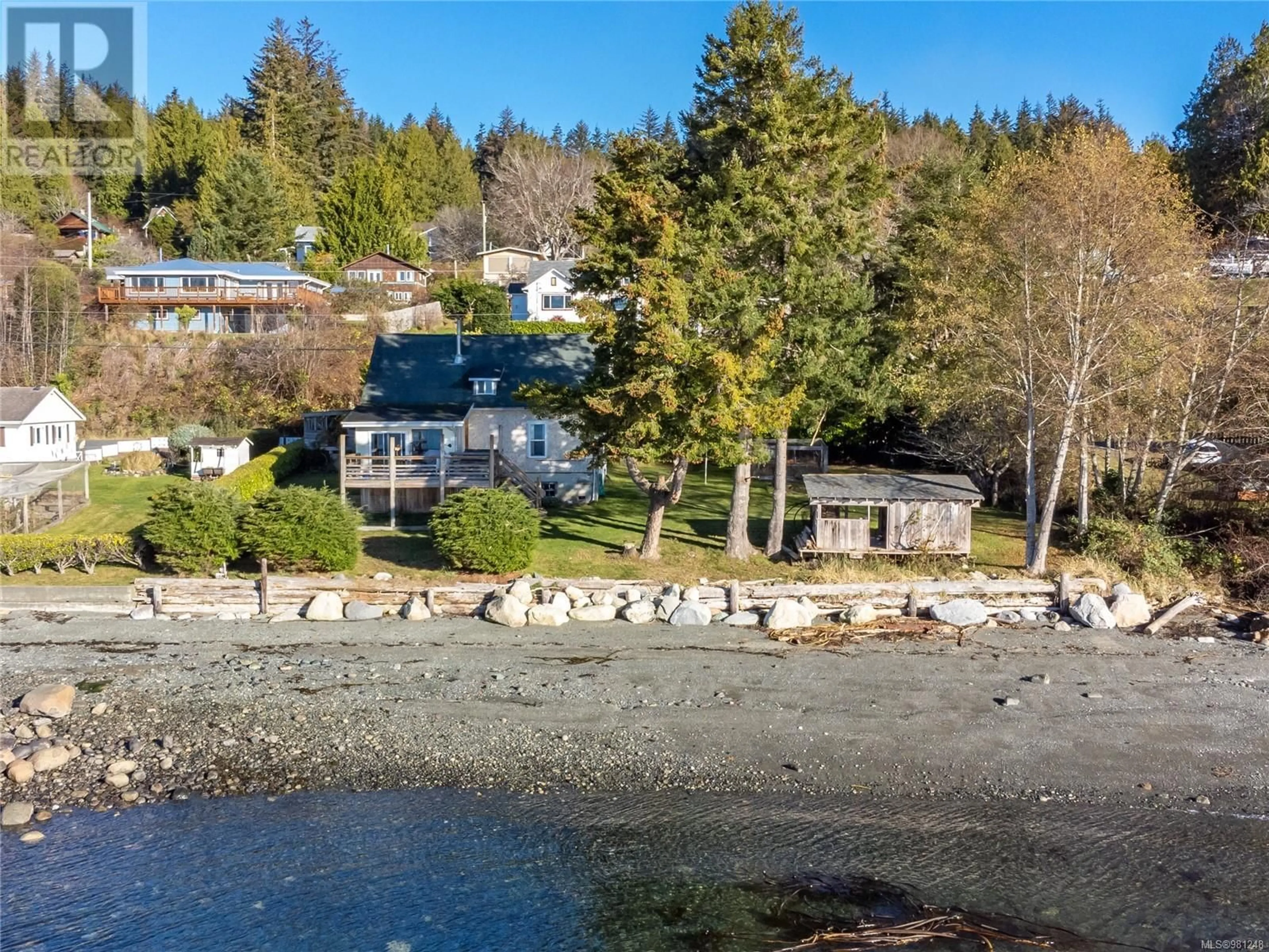 A pic from outside/outdoor area/front of a property/back of a property/a pic from drone, water/lake/river/ocean view for 310 1ST STREET, Sointula British Columbia V0N3E0