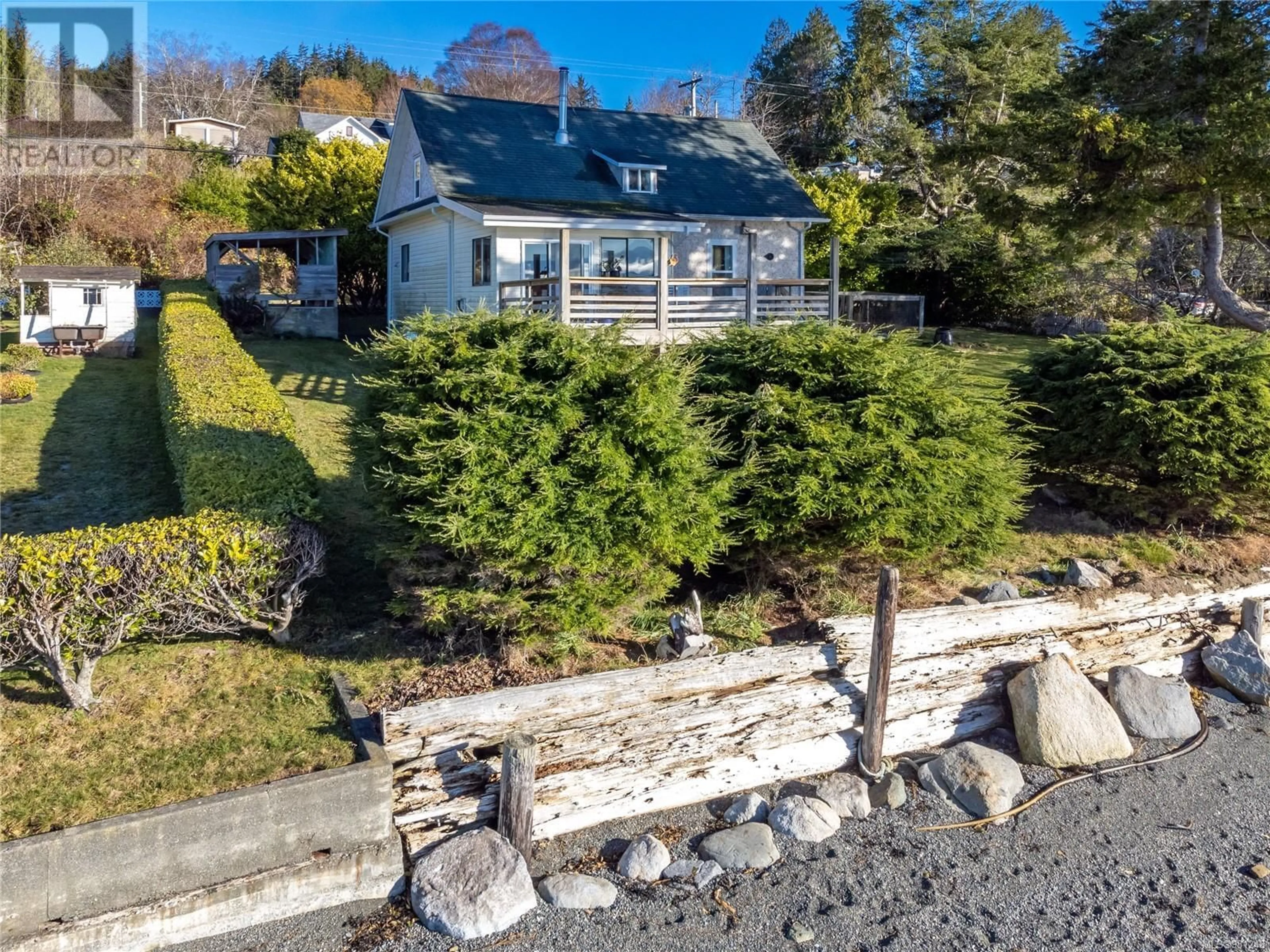 A pic from outside/outdoor area/front of a property/back of a property/a pic from drone, water/lake/river/ocean view for 310 1ST STREET, Sointula British Columbia V0N3E0