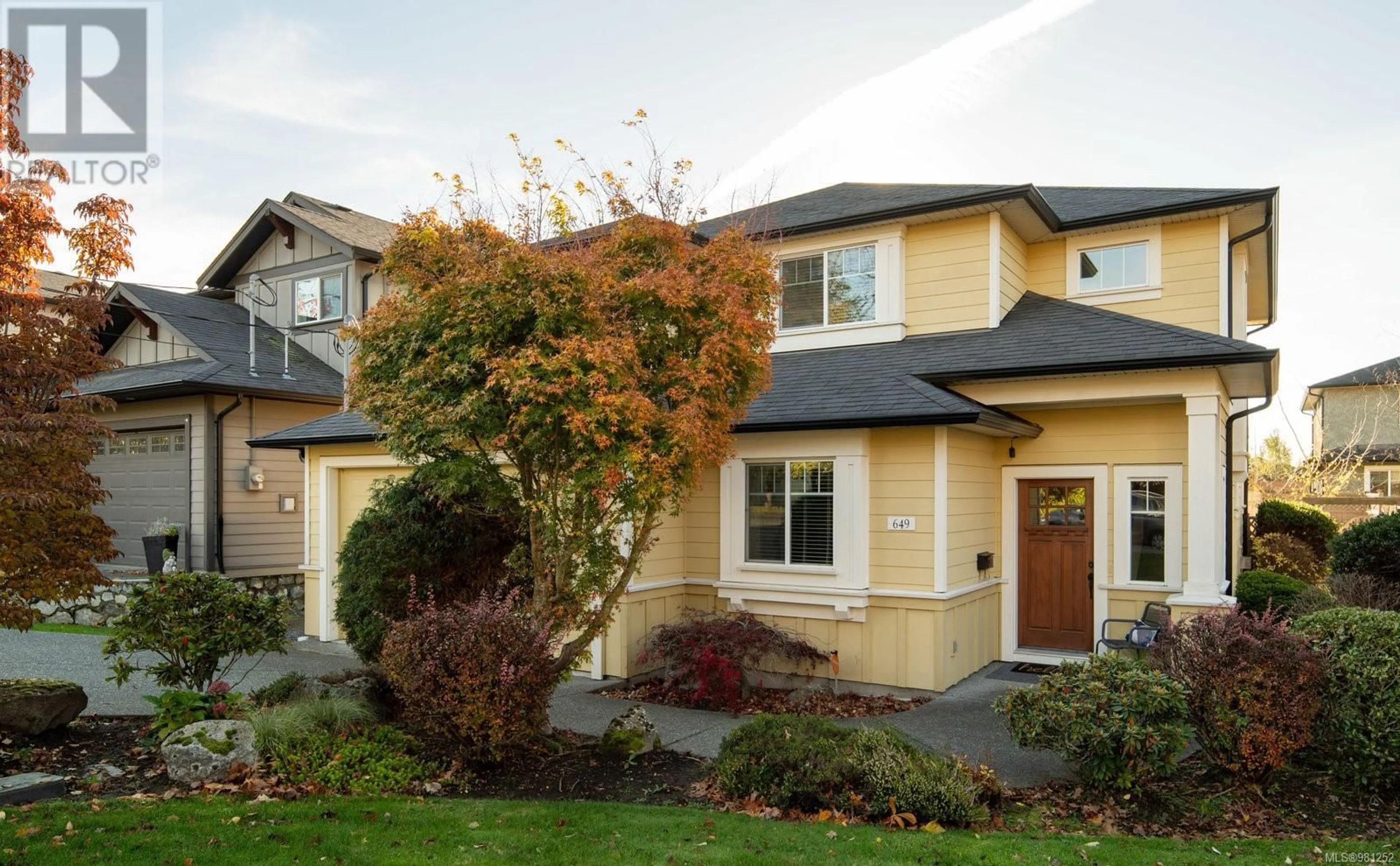 A pic from exterior of the house or condo, the fenced backyard for 649 Agnes St, Saanich British Columbia V8Z2E7