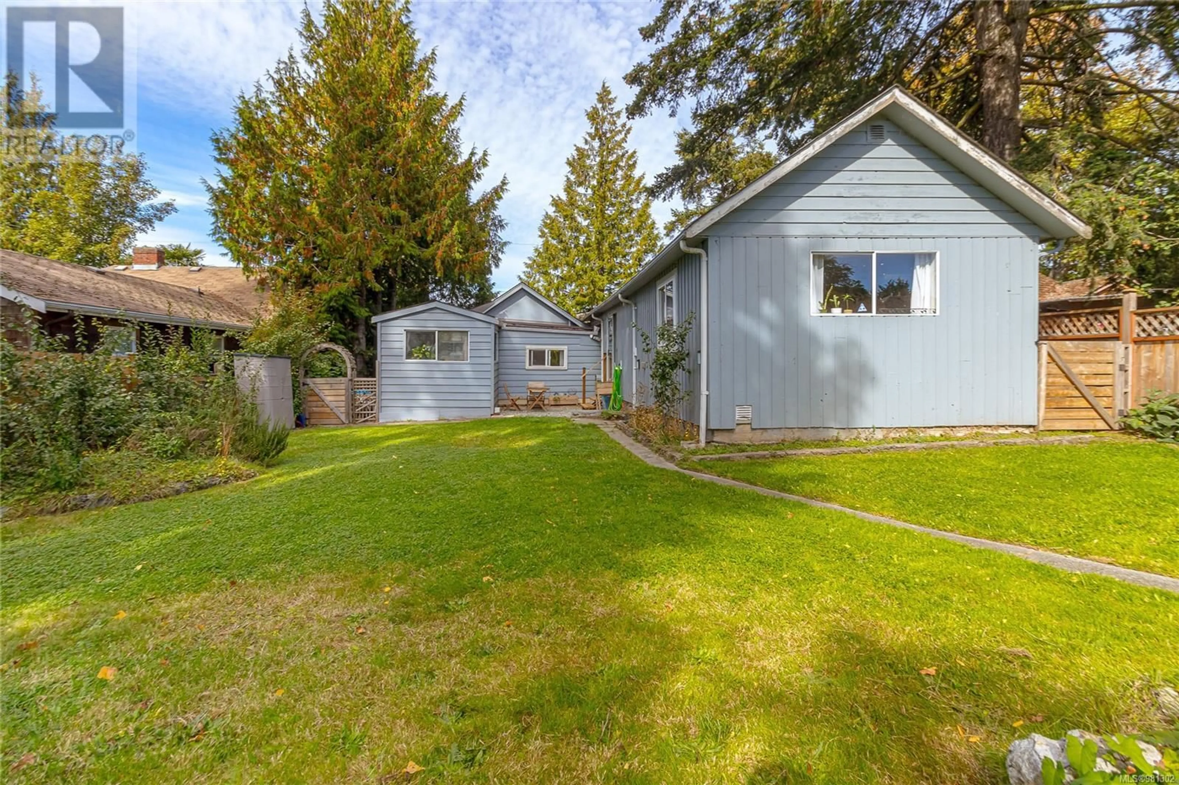 Frontside or backside of a home, the fenced backyard for 955 Darwin Ave, Saanich British Columbia V8X2X8