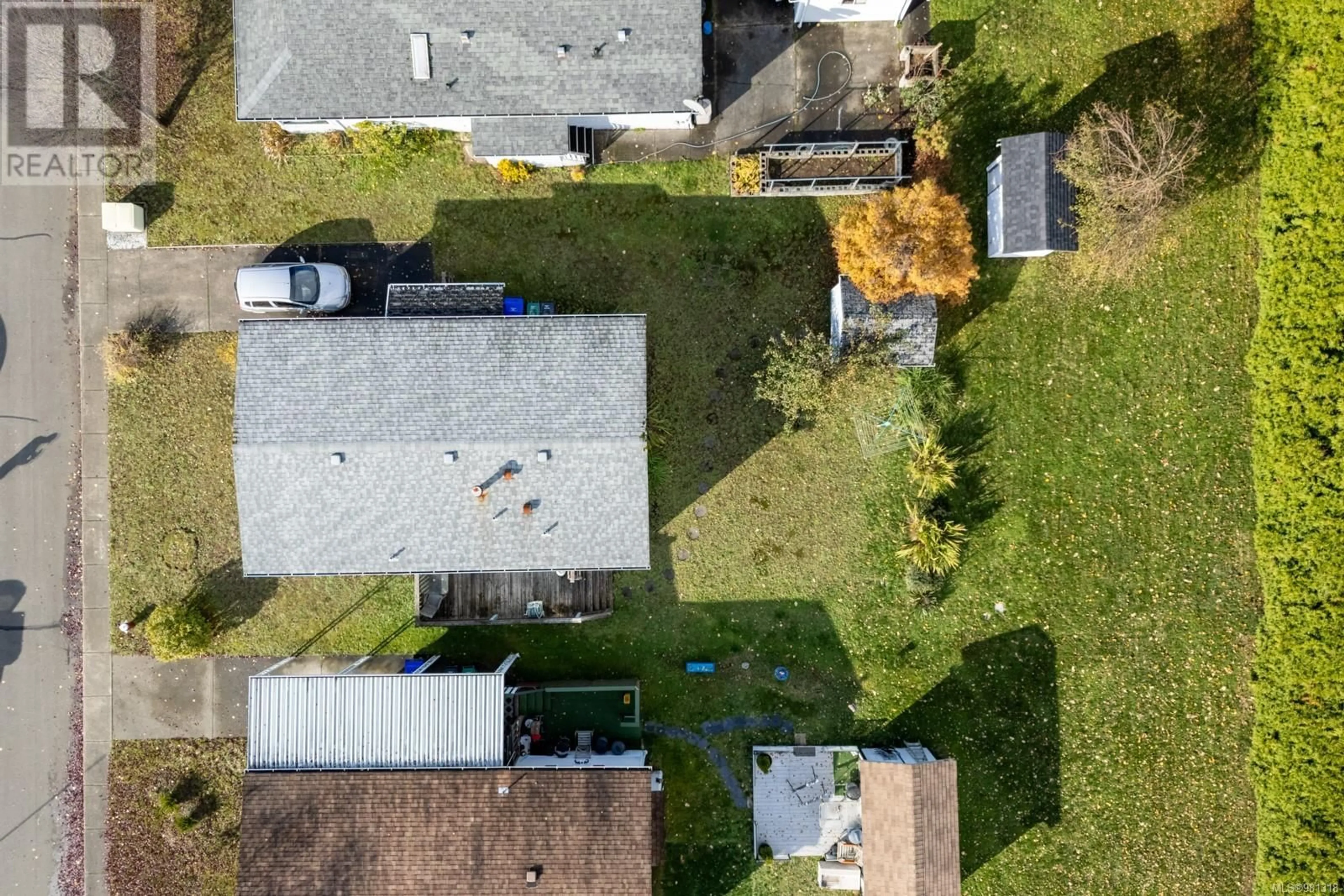 Frontside or backside of a home, the fenced backyard for 23 2140 20th St, Courtenay British Columbia V9N2G6