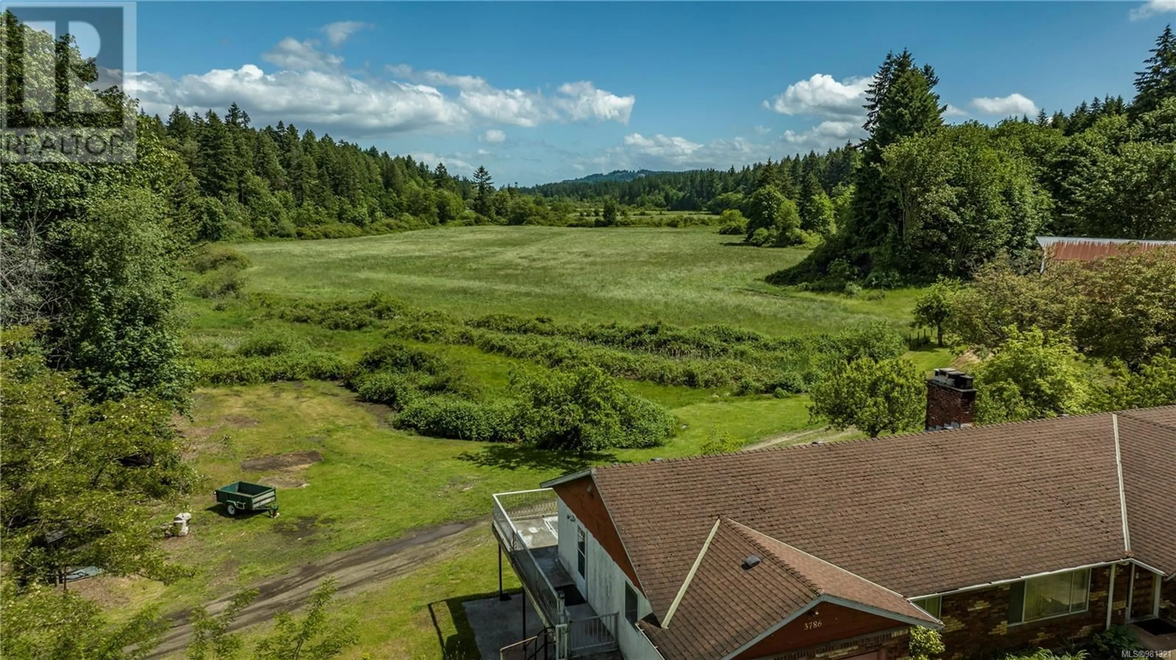 A pic from exterior of the house or condo, the fenced backyard for 3786 Jingle Pot Rd, Nanaimo British Columbia V9T5R1