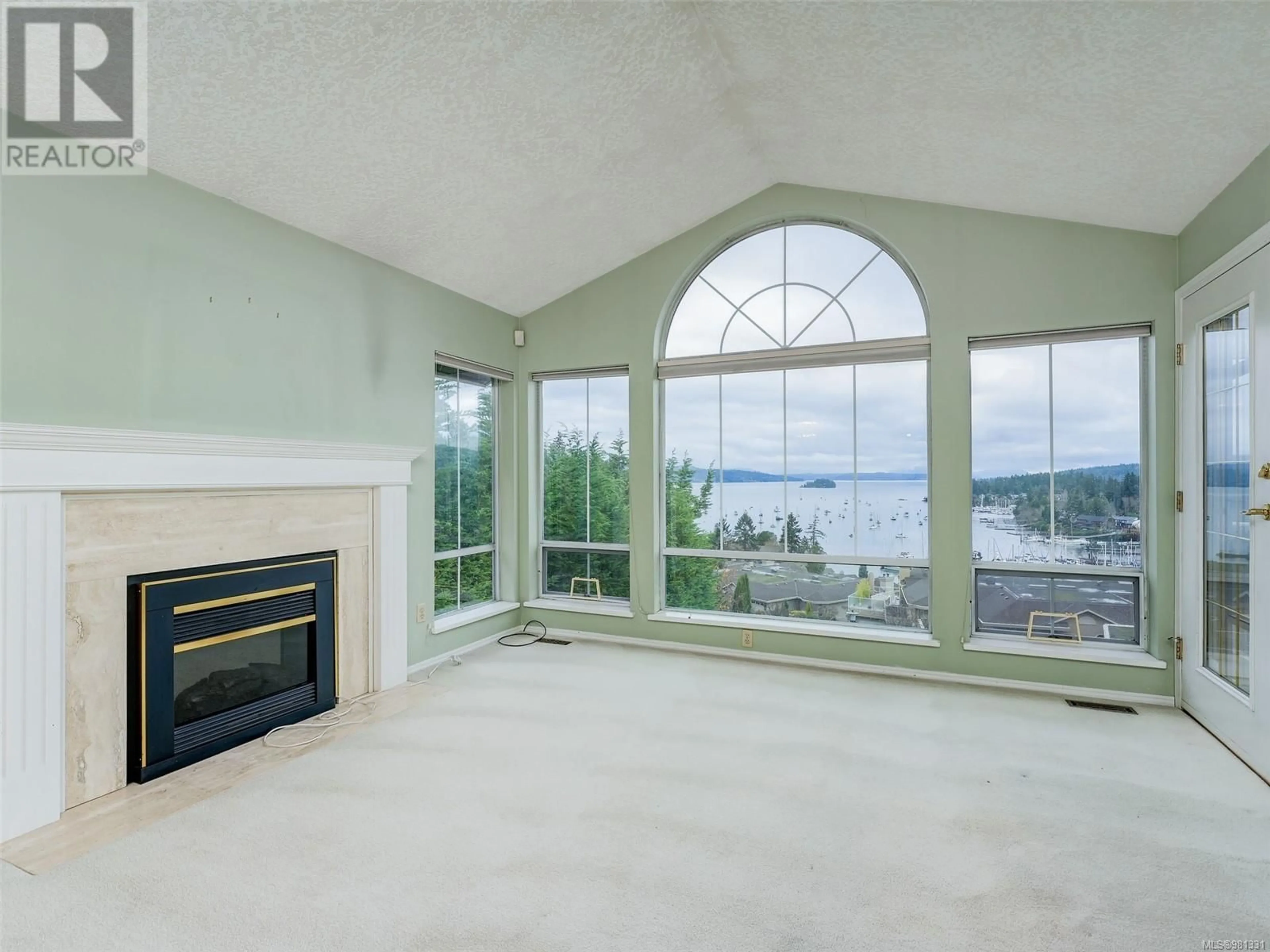 Living room, wood floors for 306 6880 Wallace Dr, Central Saanich British Columbia V8M1N8