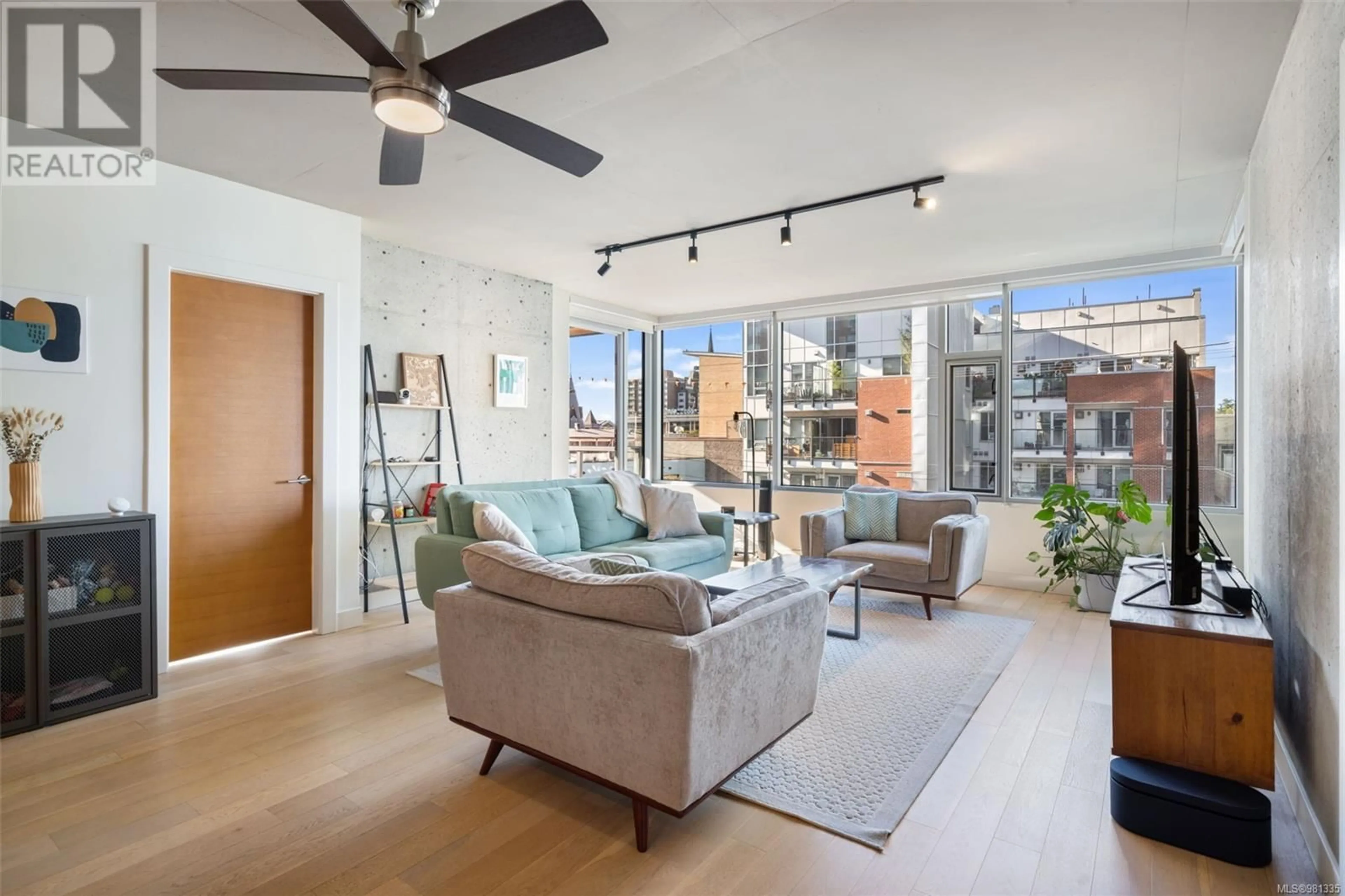 Living room, wood floors for 304 989 Johnson St, Victoria British Columbia V8V0E3