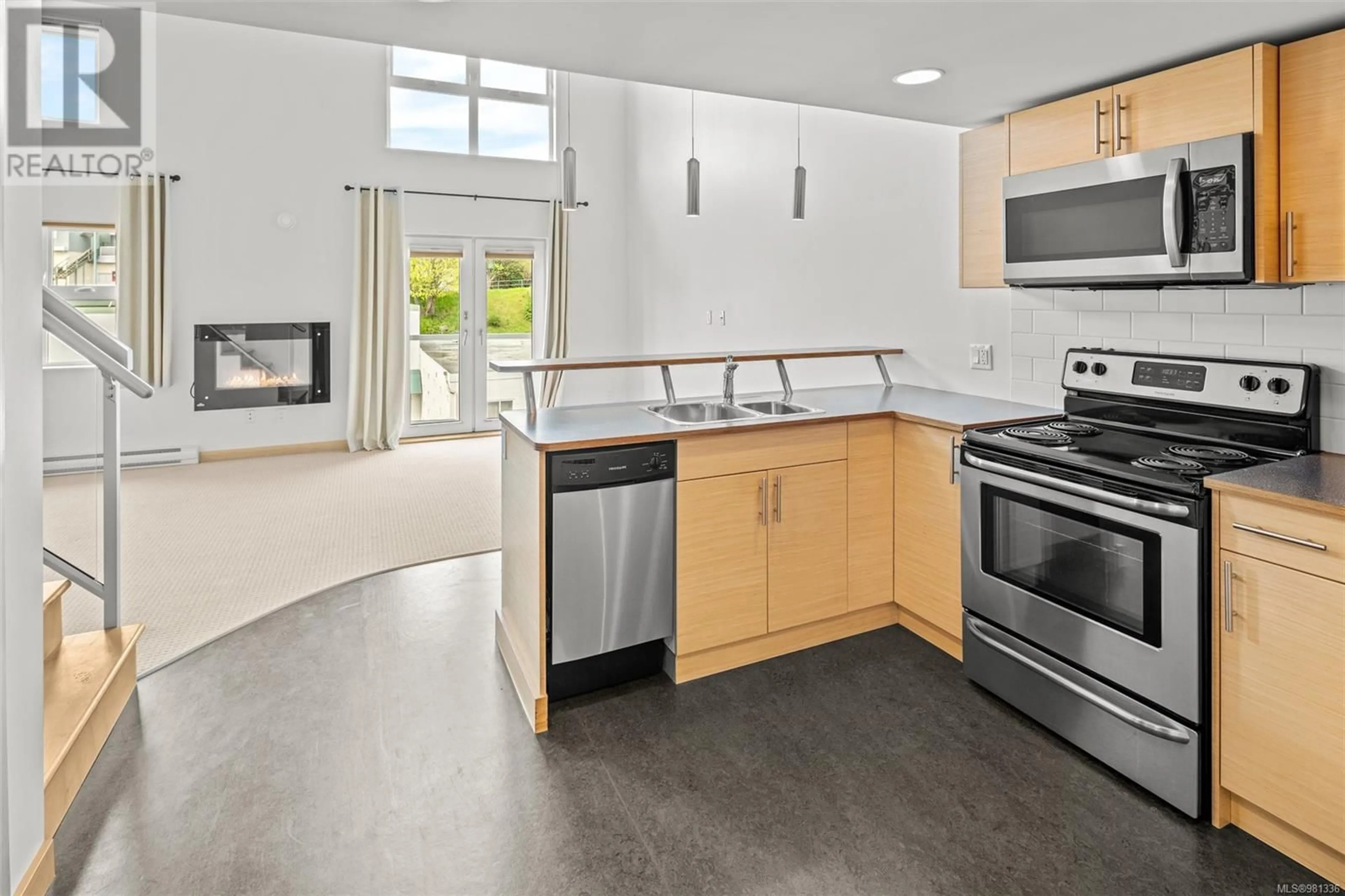 Open concept kitchen for 402 787 Tyee Rd, Victoria British Columbia V9A7R5