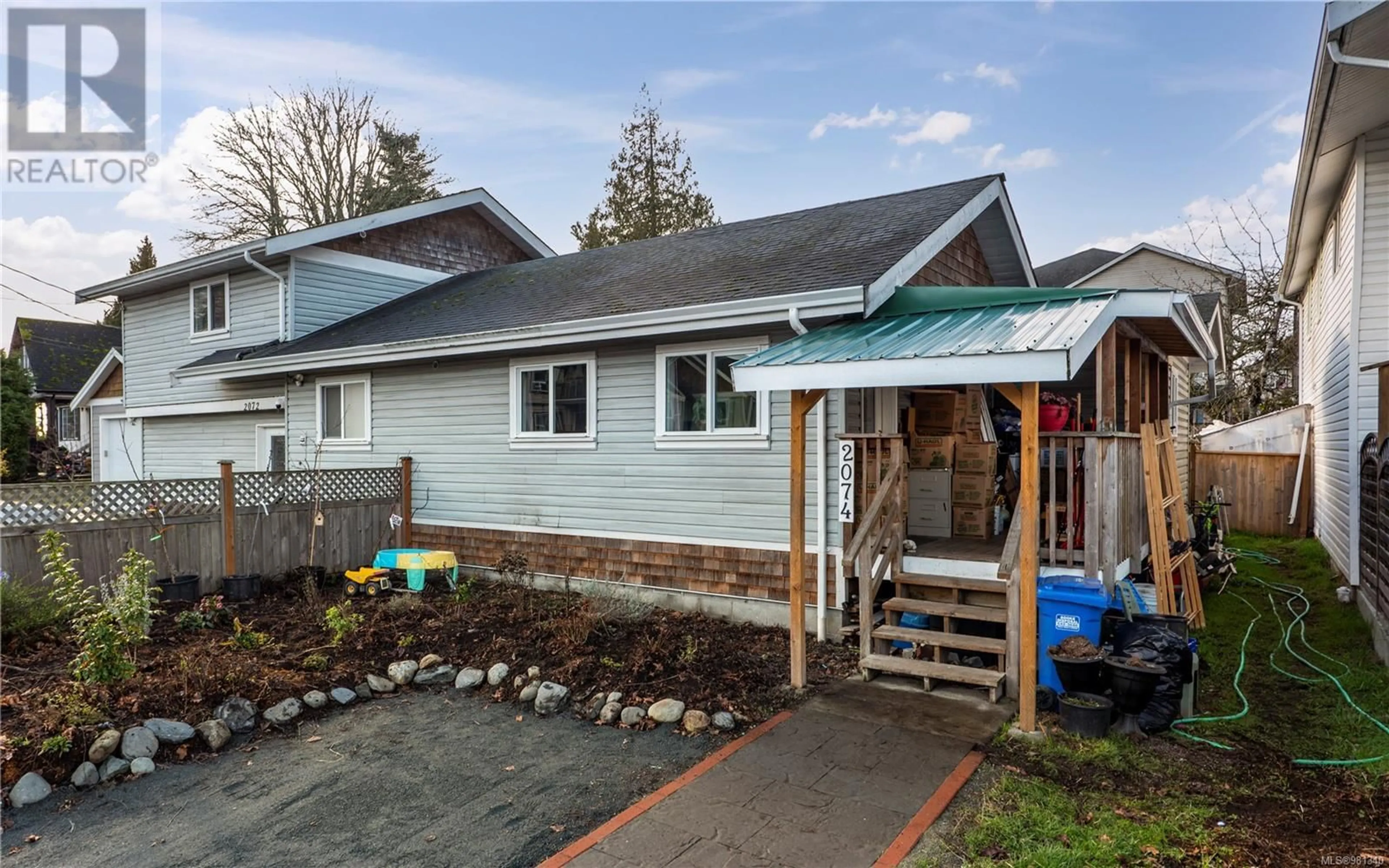 Frontside or backside of a home, the fenced backyard for 2074 Dover St, Sooke British Columbia V9Z0Z1