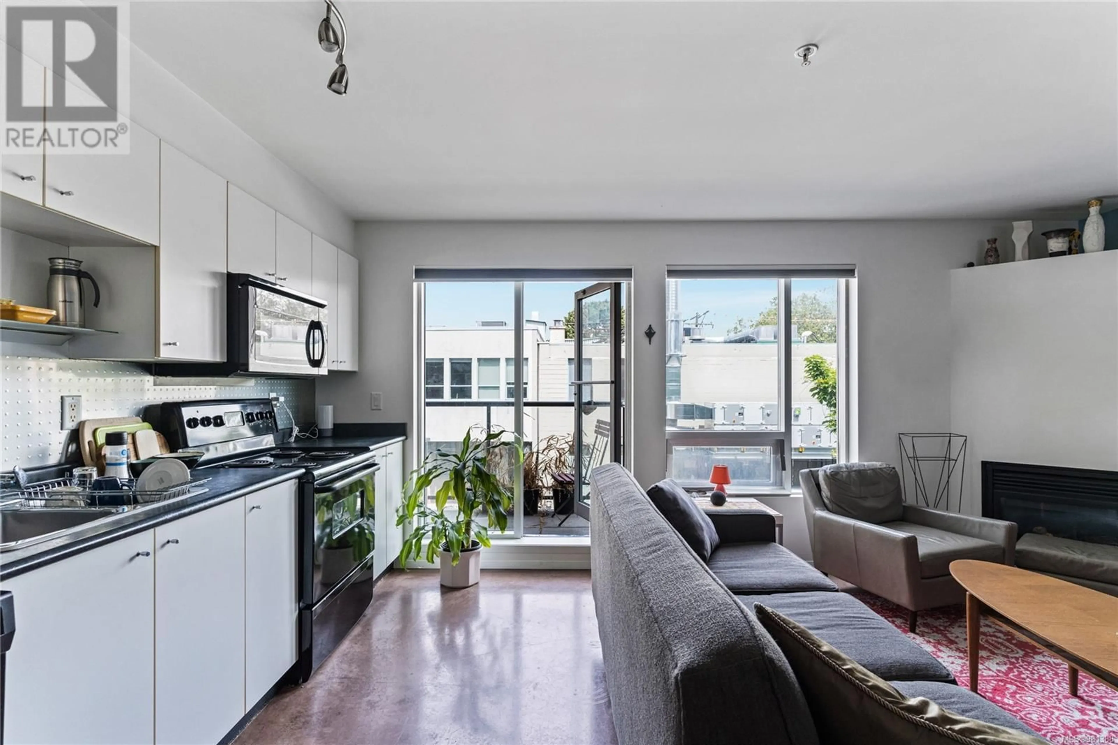 Living room, wood floors for 206 932 Johnson St, Victoria British Columbia V8V3W3