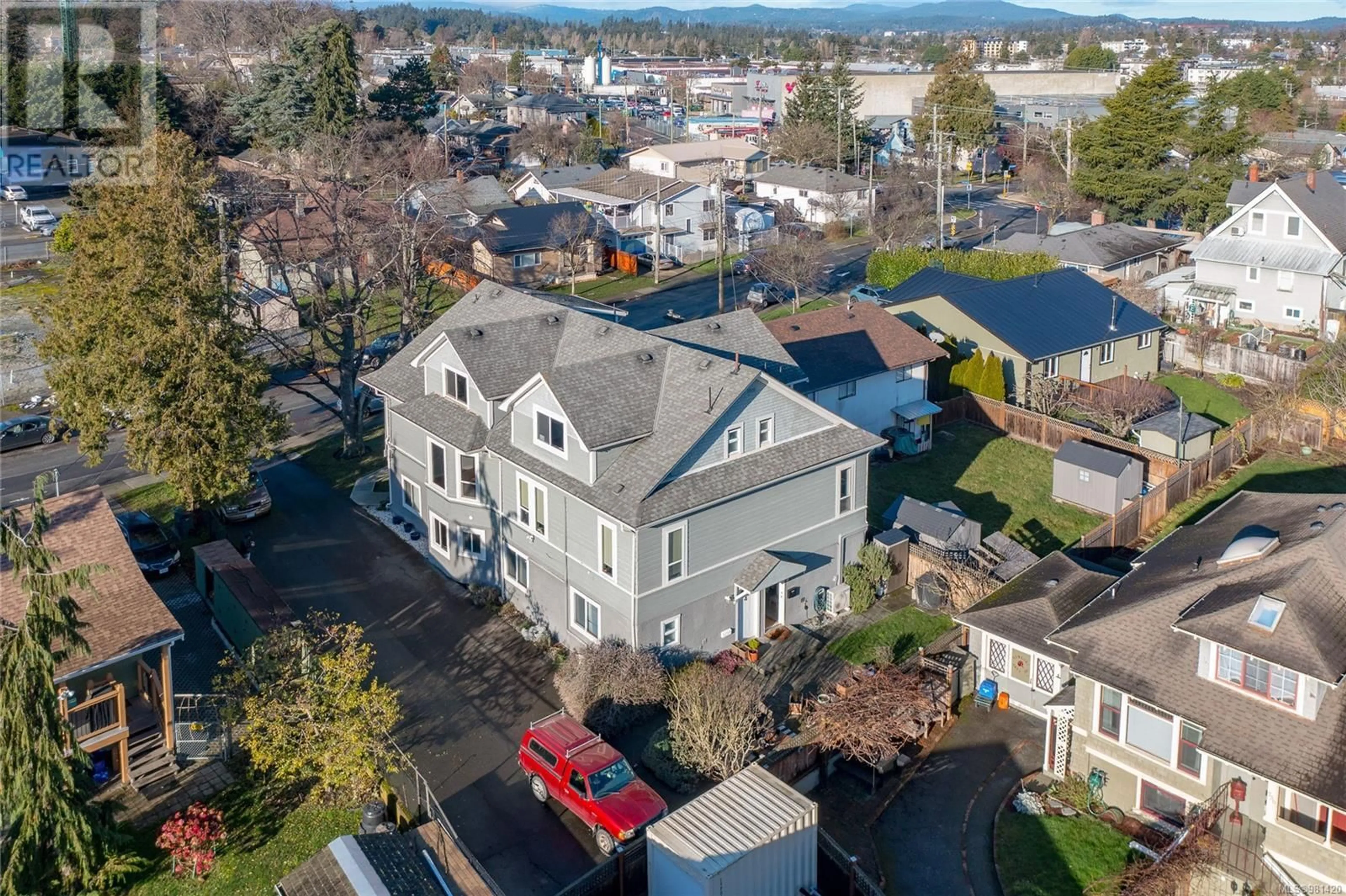 A pic from outside/outdoor area/front of a property/back of a property/a pic from drone, street for 2 635 Rothwell St, Victoria British Columbia V9A4E3