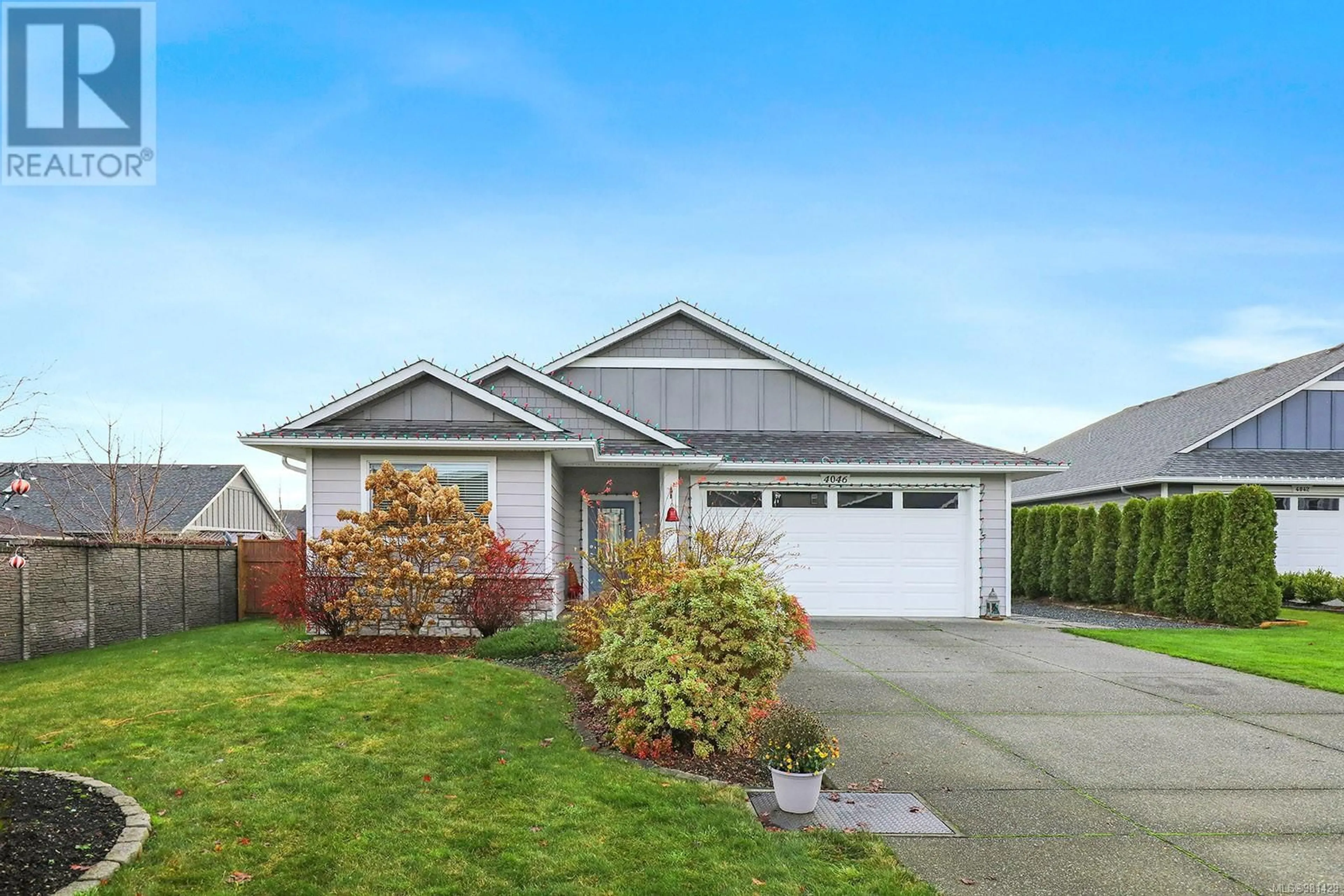 Frontside or backside of a home, the fenced backyard for 4046 Chancellor Cres, Courtenay British Columbia V9N0B6