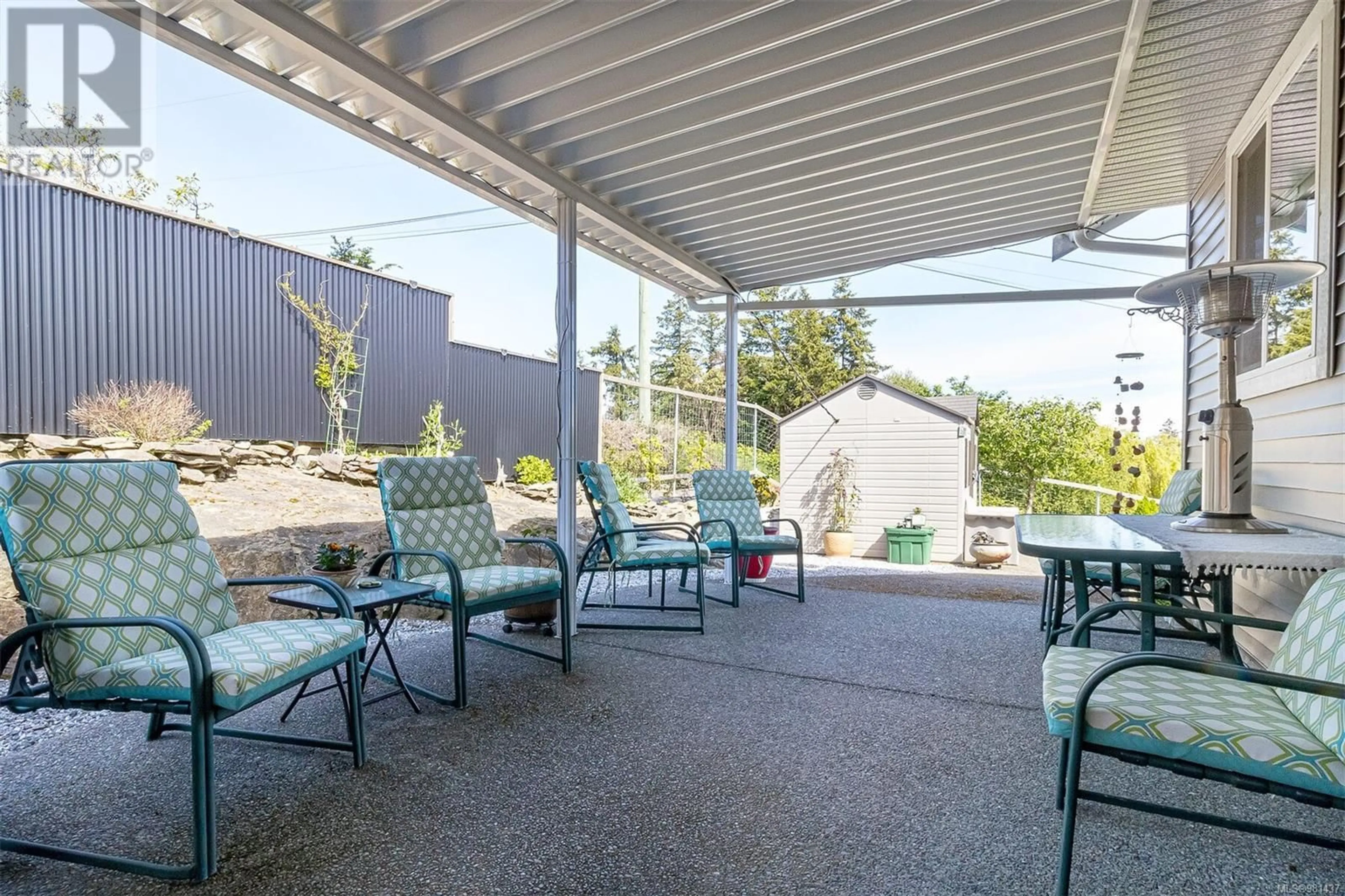 Patio, the fenced backyard for 9918 Victoria Rd, Chemainus British Columbia V0R1K2