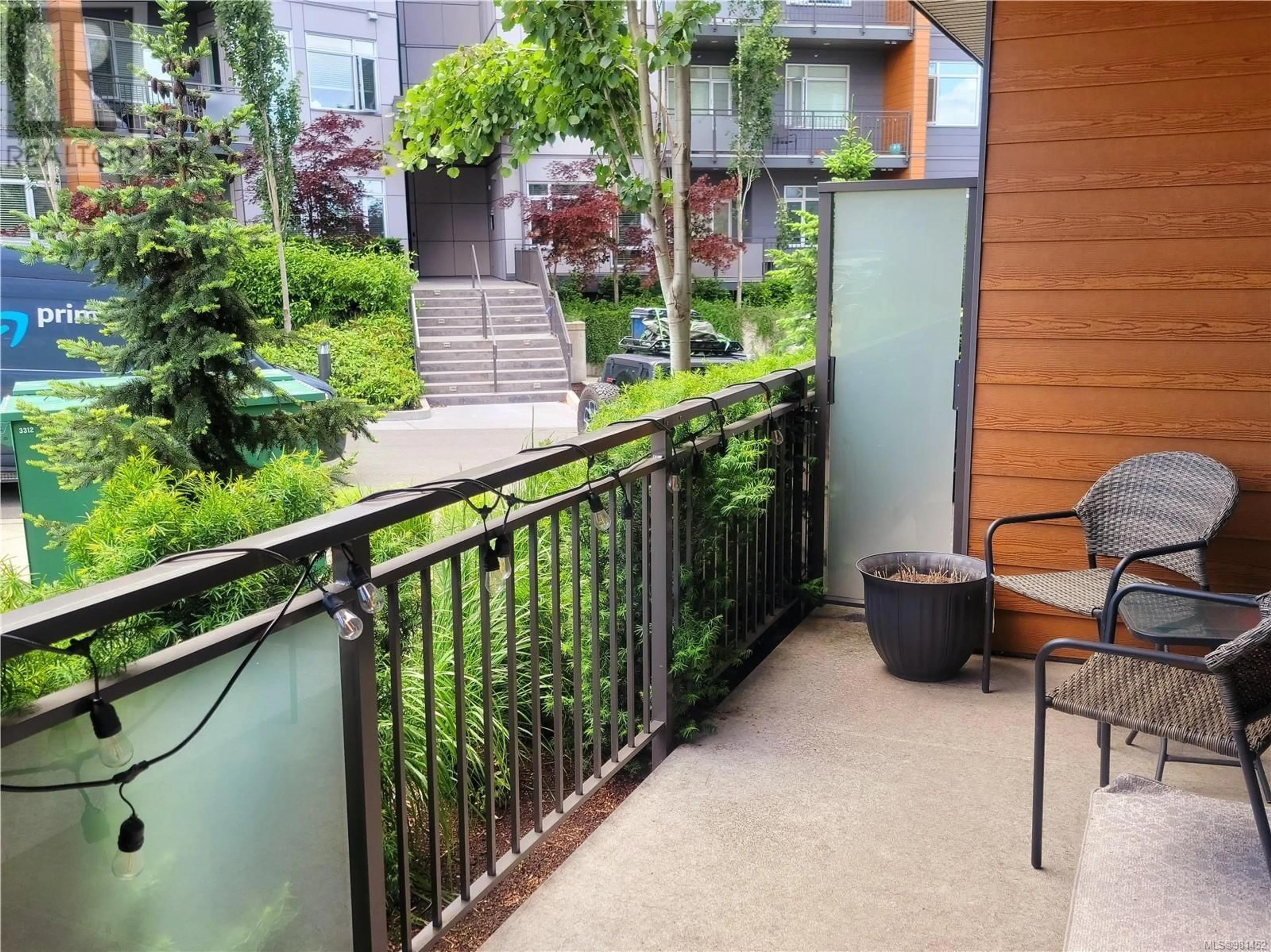 Balcony in the apartment, the fenced backyard for 107 6544 Metral Dr, Nanaimo British Columbia V9T2L8