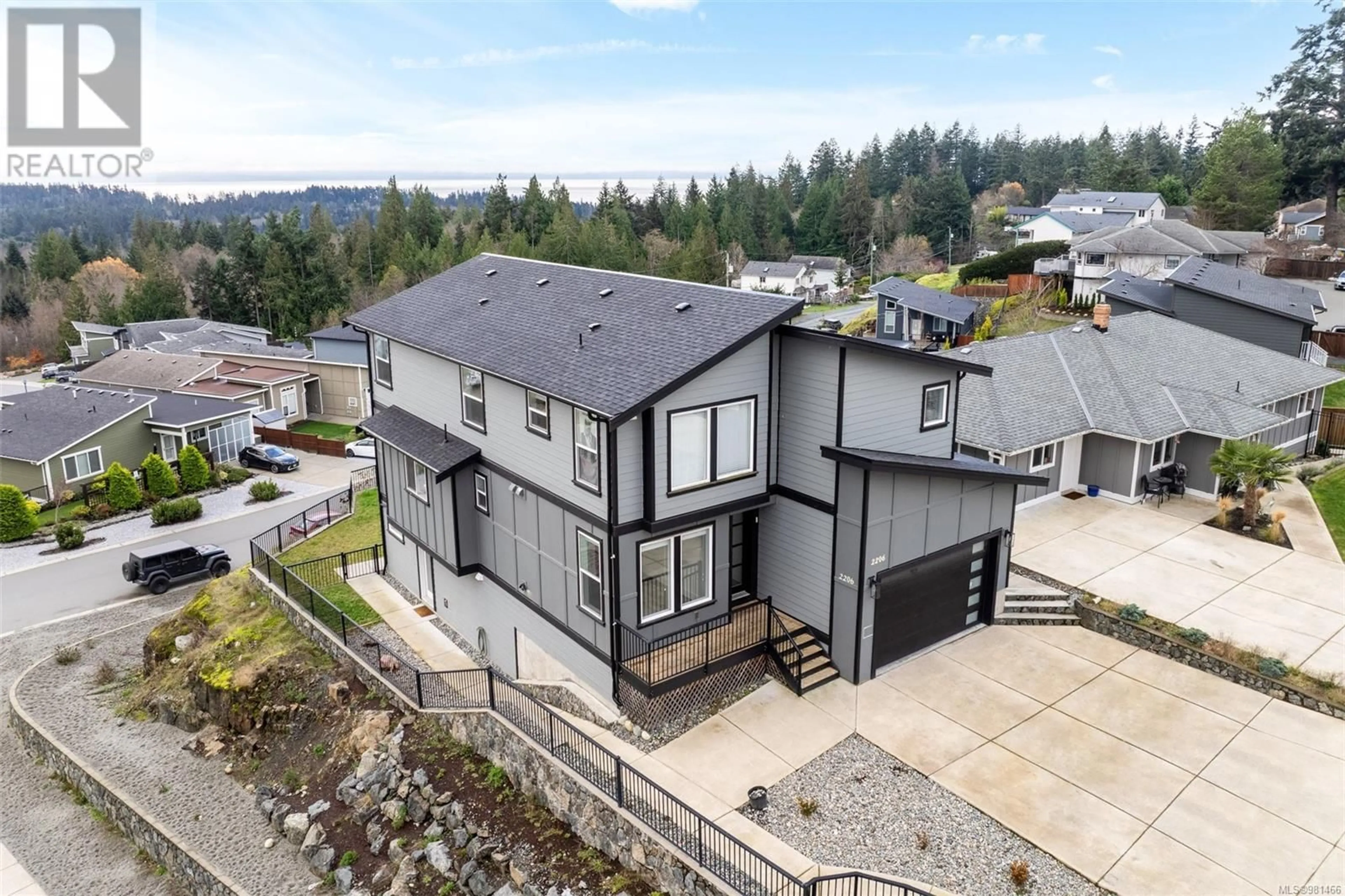 Frontside or backside of a home, the fenced backyard for 2206 Winfield Dr, Sooke British Columbia V9Z0N1