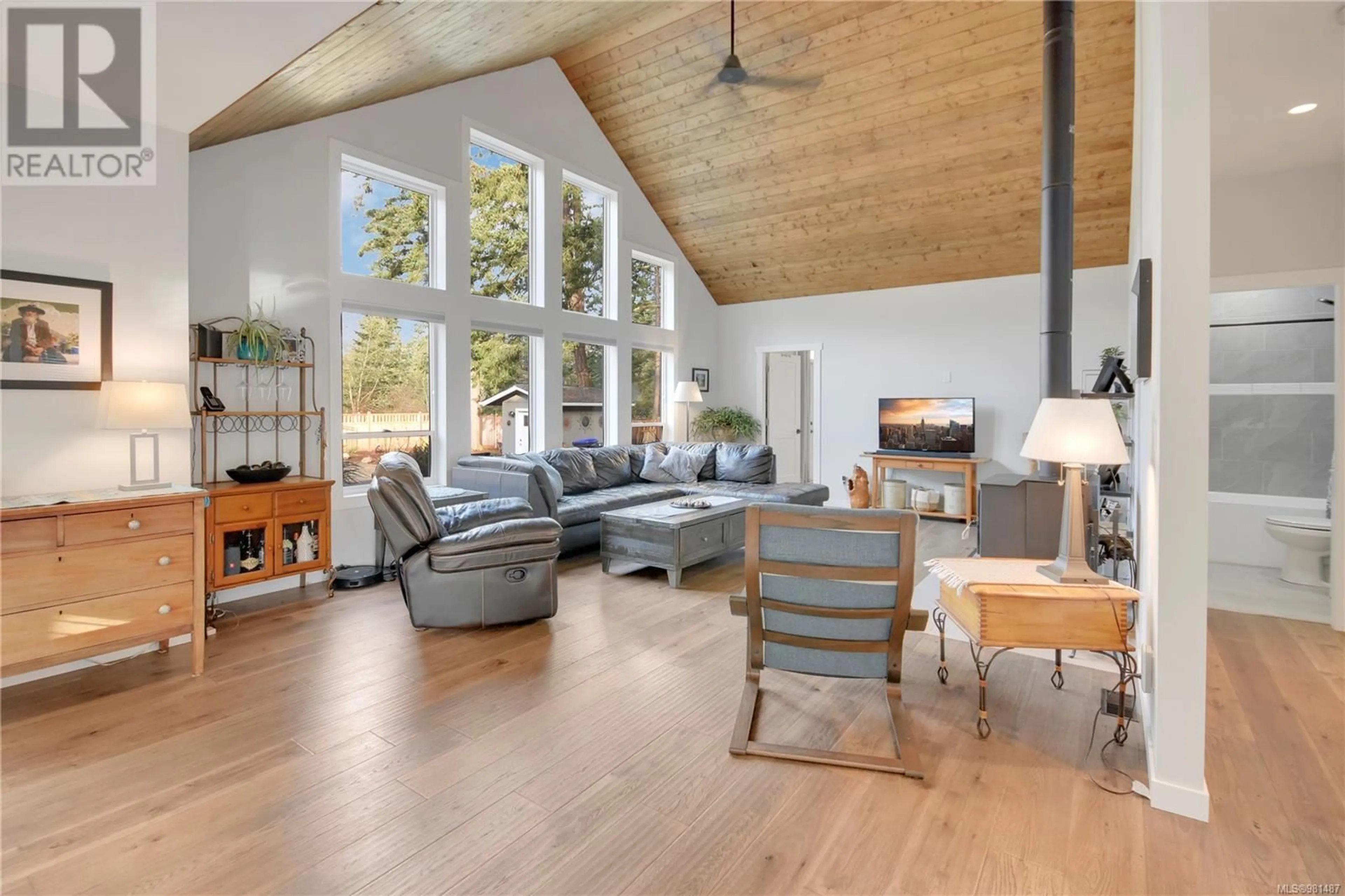 Living room with furniture, wood/laminate floor for 750 Captain Ahab's Terr, Gabriola Island British Columbia V0R1X5