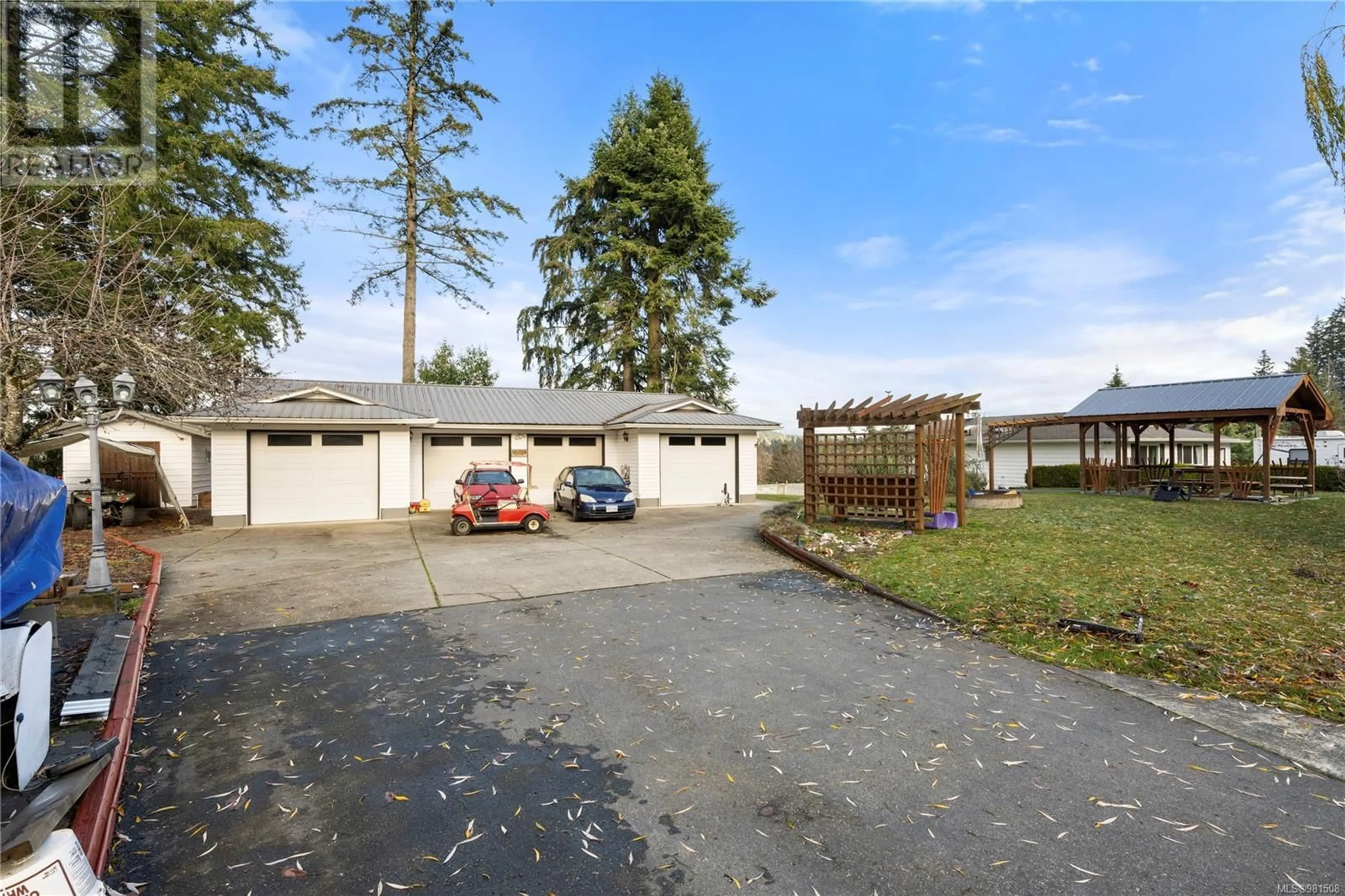 Frontside or backside of a home, the fenced backyard for 3623 Ranch Point Rd, Nanaimo British Columbia V9R6X2