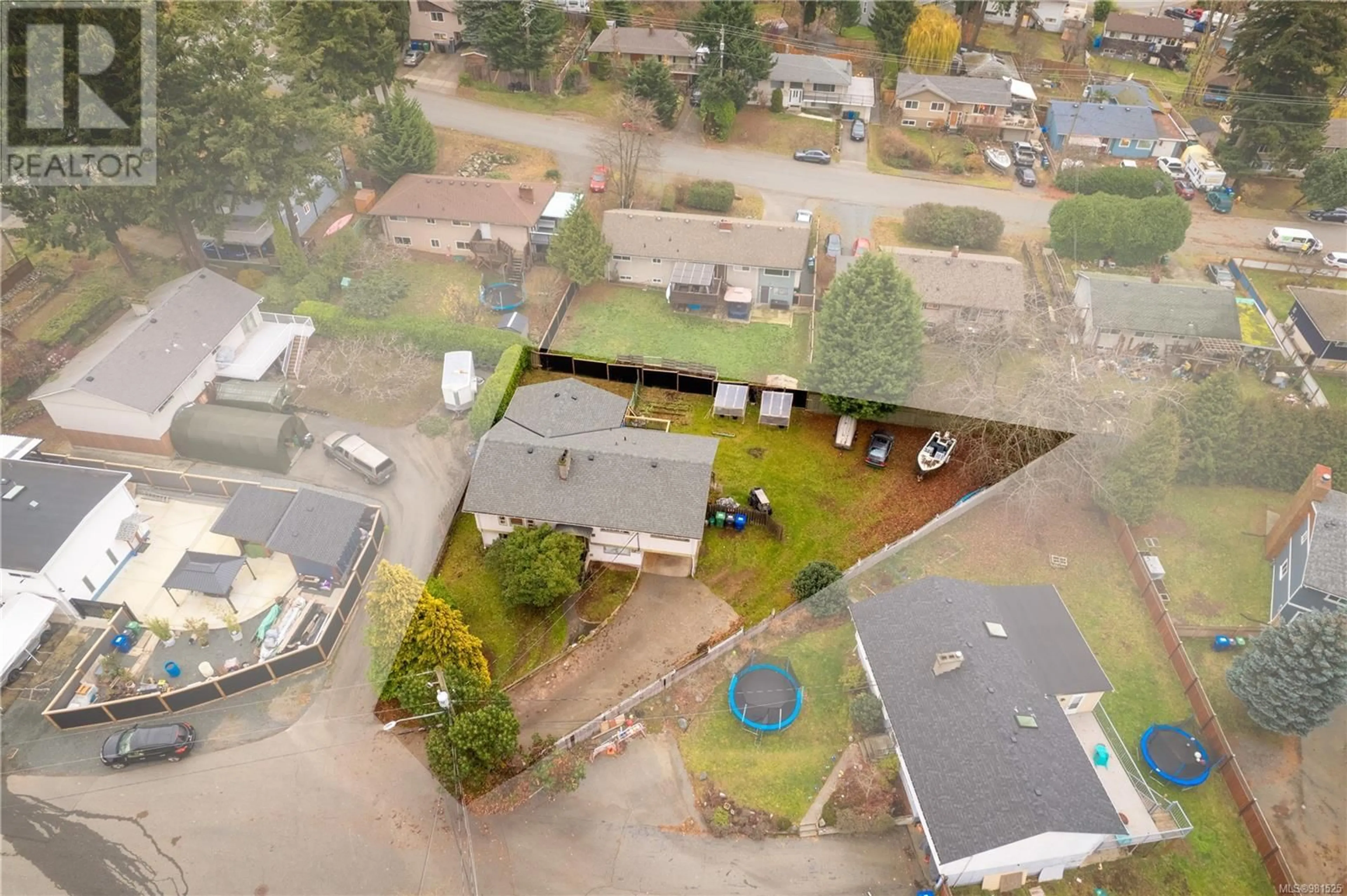 Frontside or backside of a home, the fenced backyard for 1020 Hawkes Turnaround, Nanaimo British Columbia V9S2S5