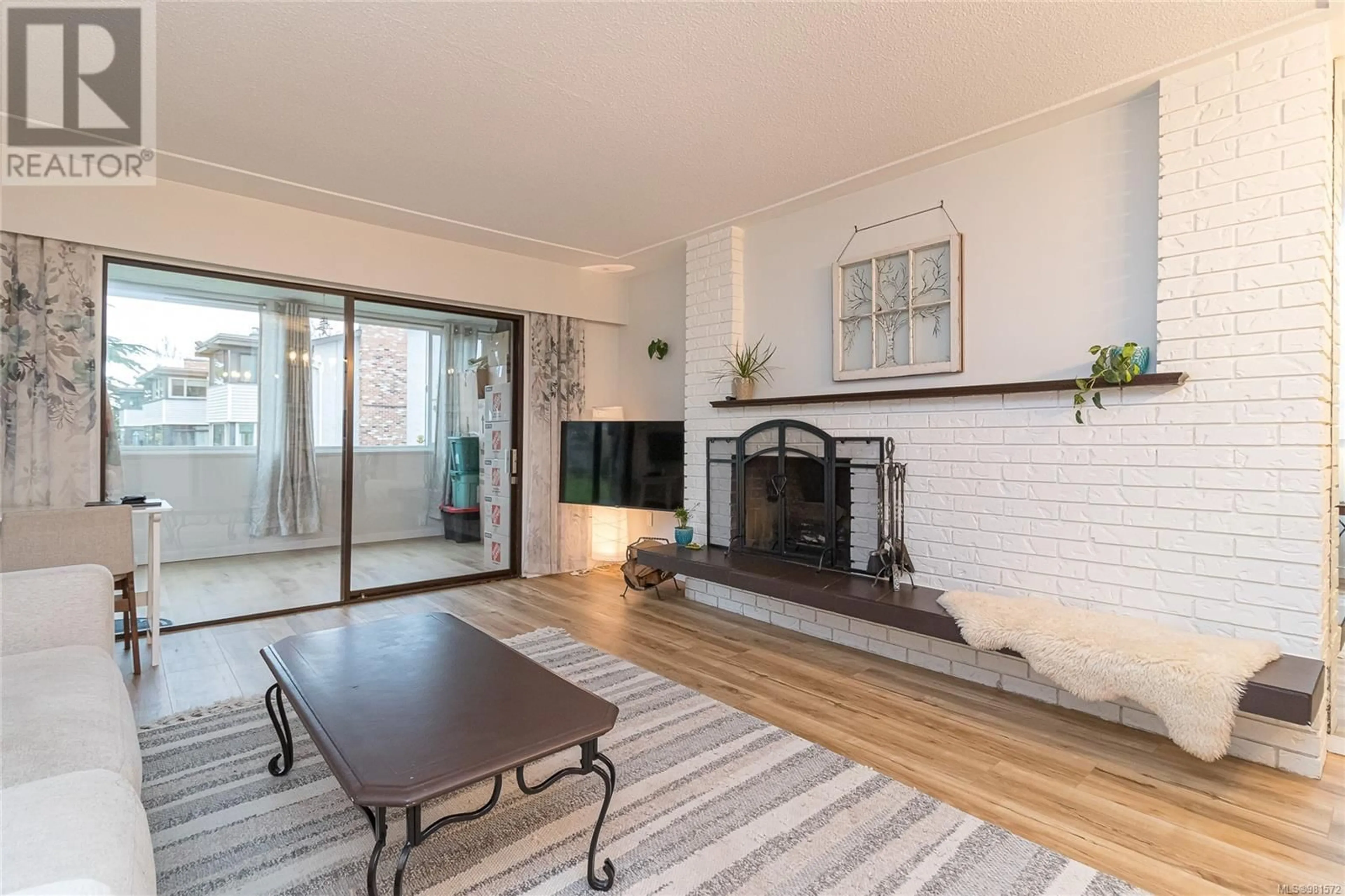 Living room, wood floors for 106 3160 Irma St, Victoria British Columbia V9A1S8