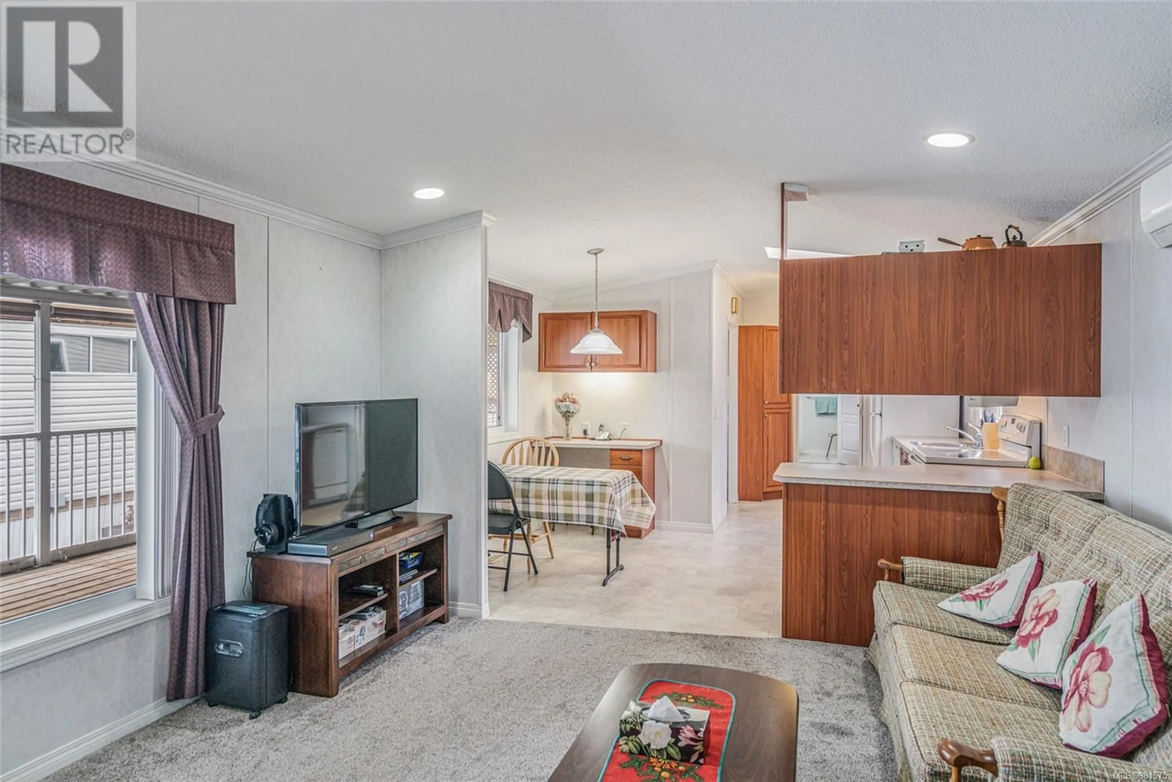 Living room, ceramic floors for 18 6245 Metral Dr, Nanaimo British Columbia V9T6P8