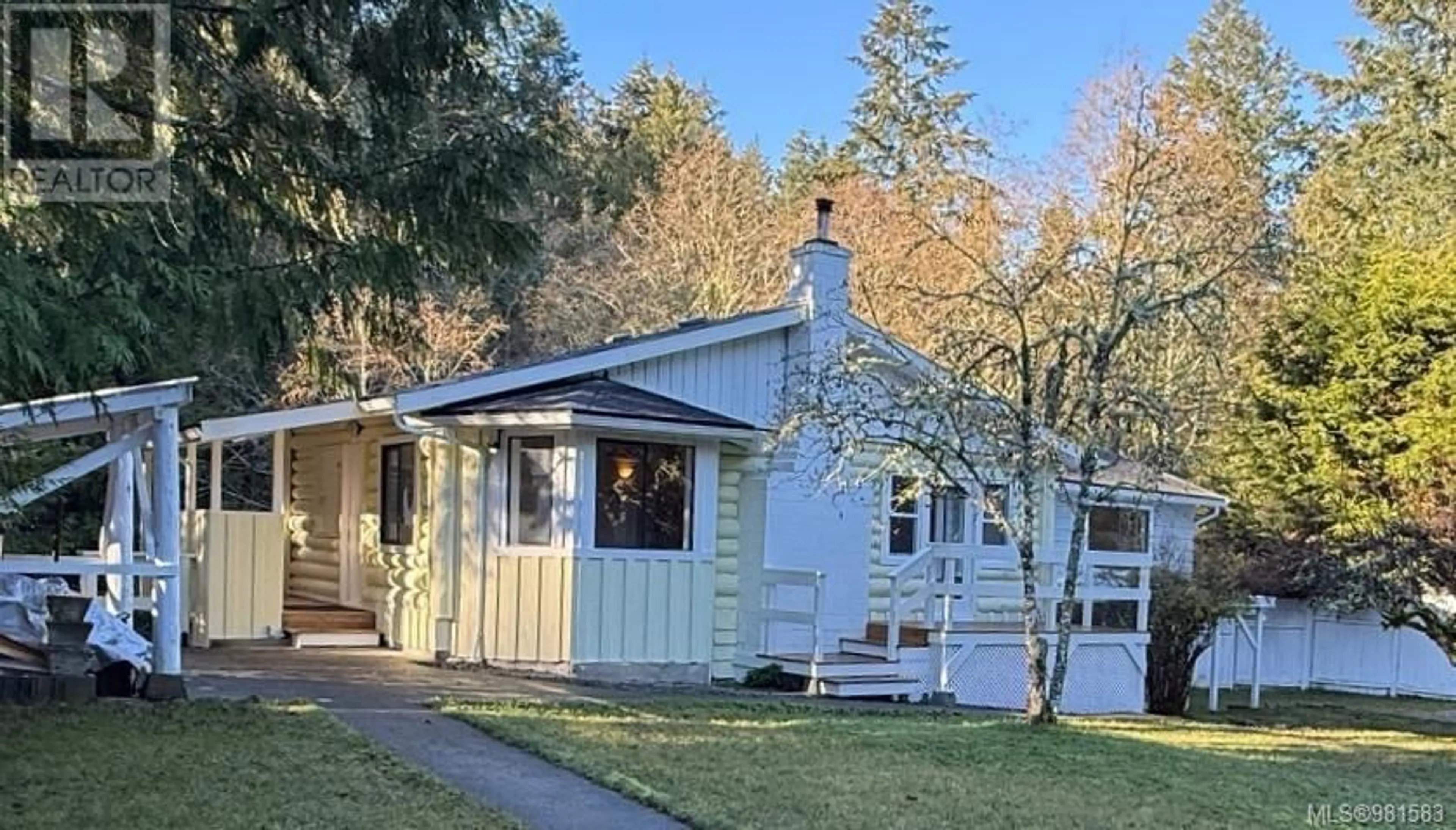 Home with vinyl exterior material, street for 5824 Wallace Rd, Pender Island British Columbia V0N2M2