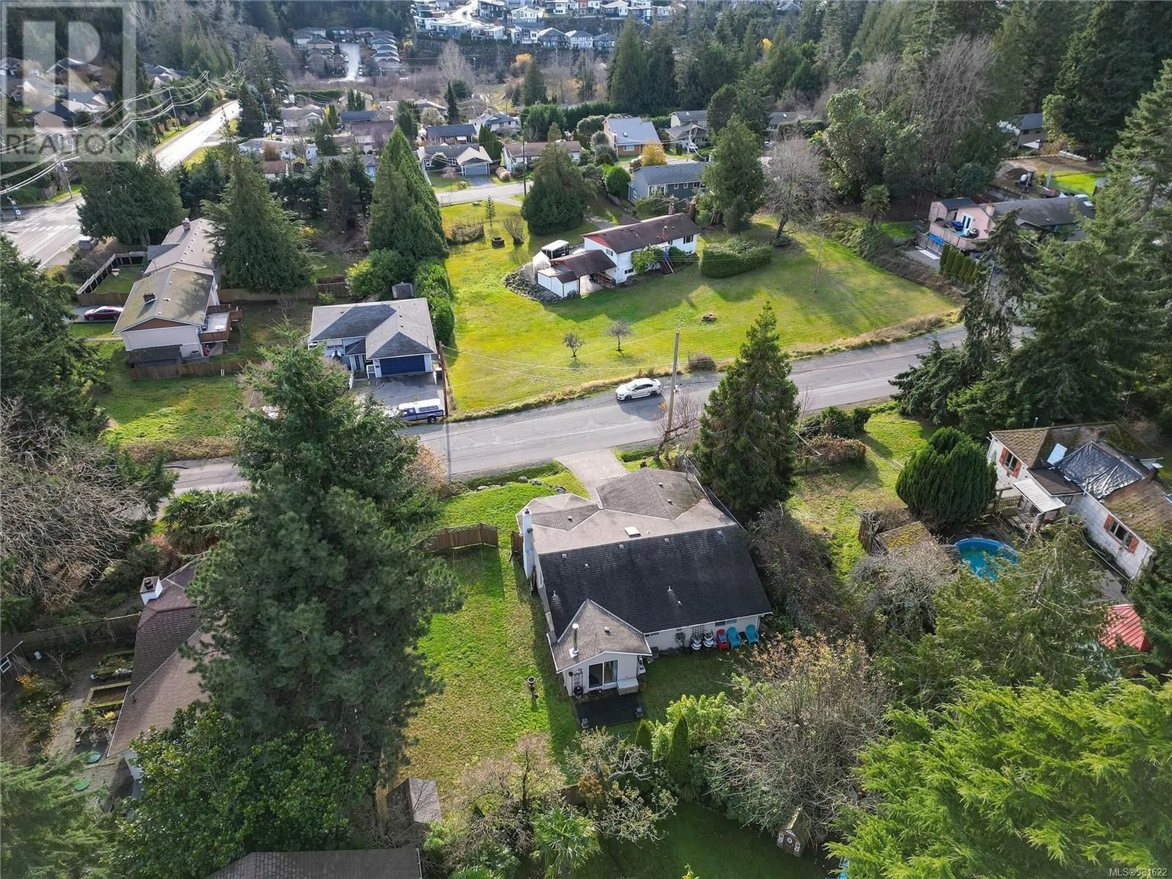 Frontside or backside of a home, the fenced backyard for 506 Windthrop Rd, Colwood British Columbia V9C3B5